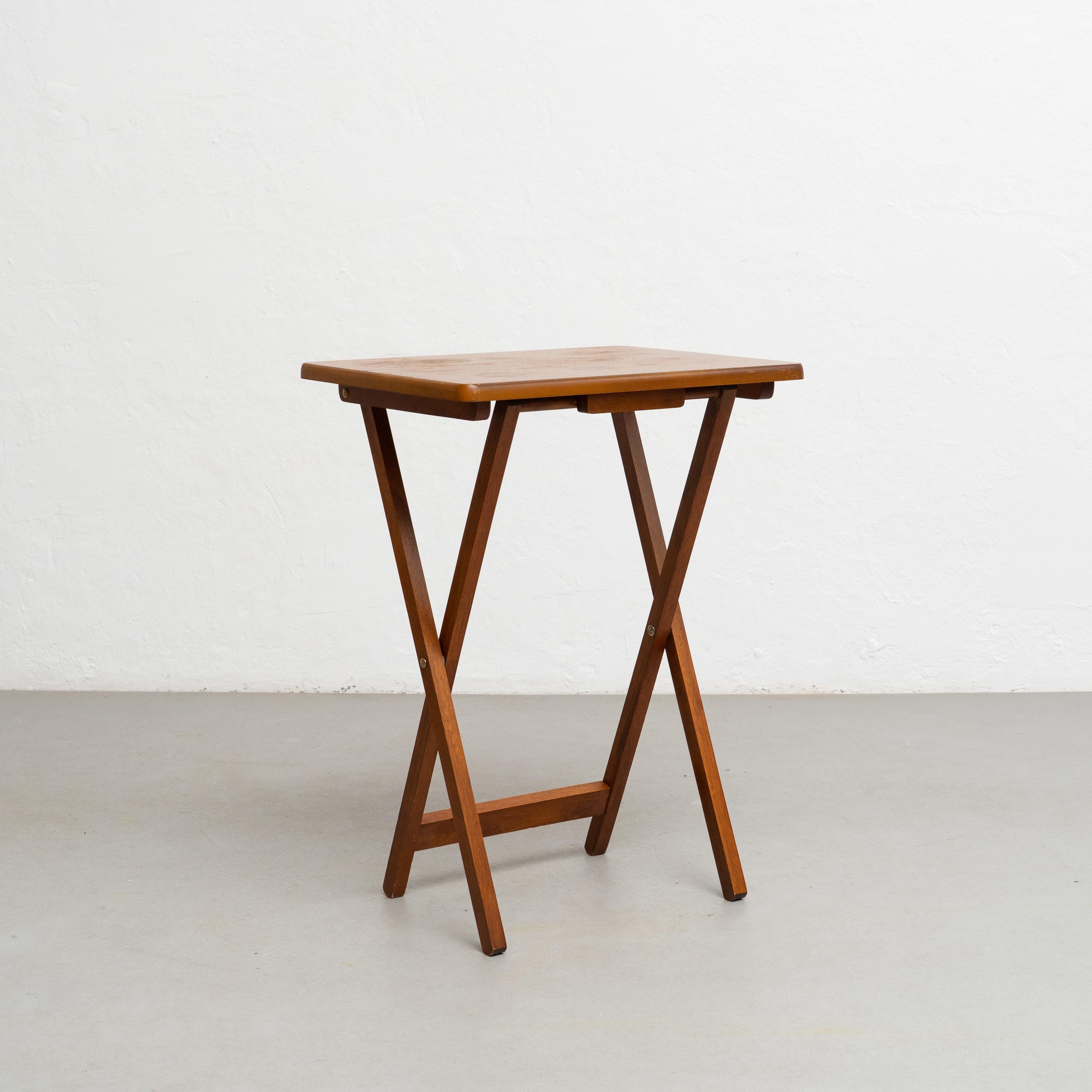 Folding wood Table, circa 1960.

By unknown artisan in Spain, circa 1960.

In good original condition, with minor wear consistent with age and use, preserving a beautiful patina.

Materials:
Wood.