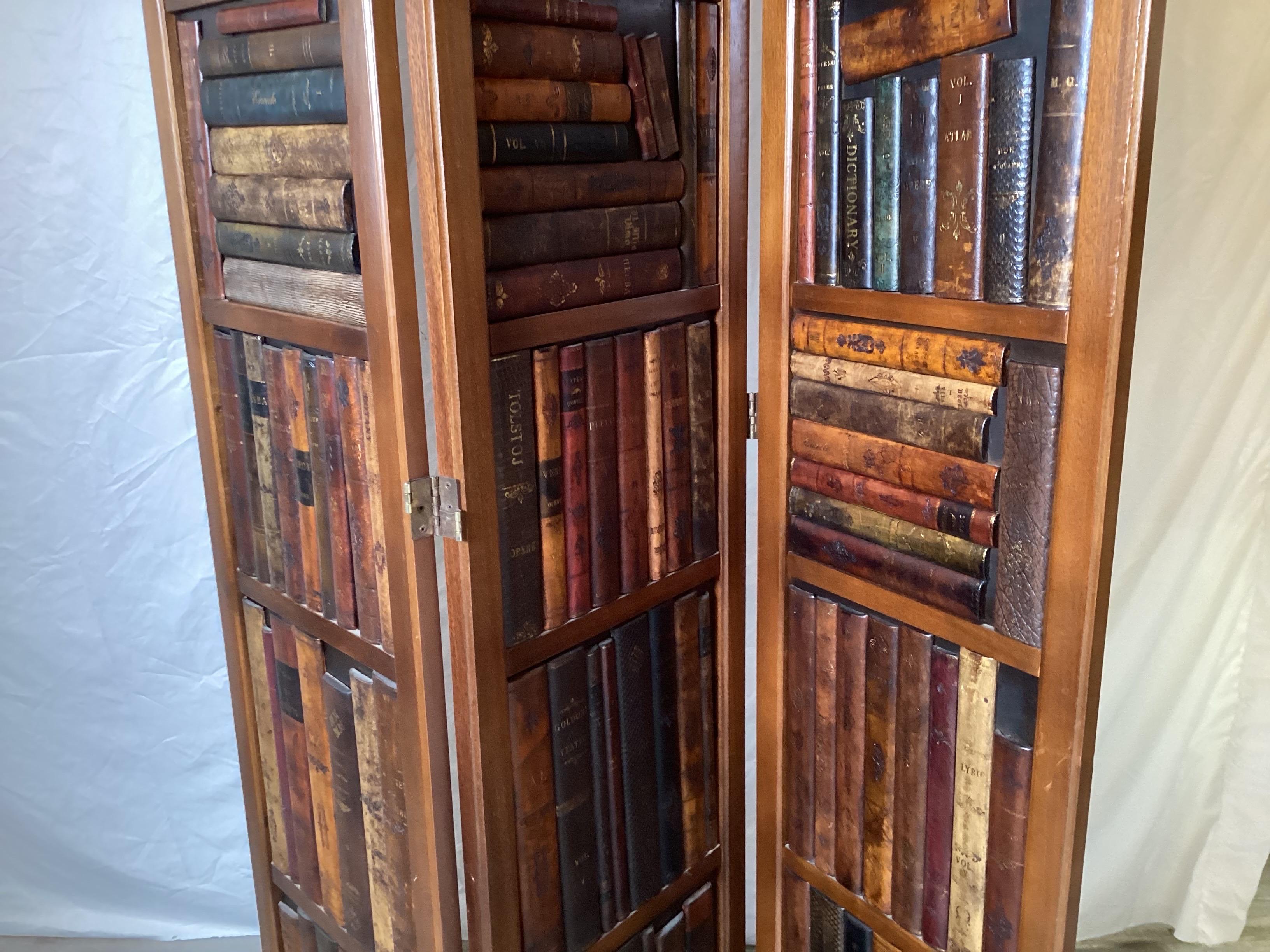 A handsome three panel screen in mahogany with faux leather bound book front.  Each panel measures 71 inches tall by 16 inches wide.  Total width at 50 inches when fully extended.  