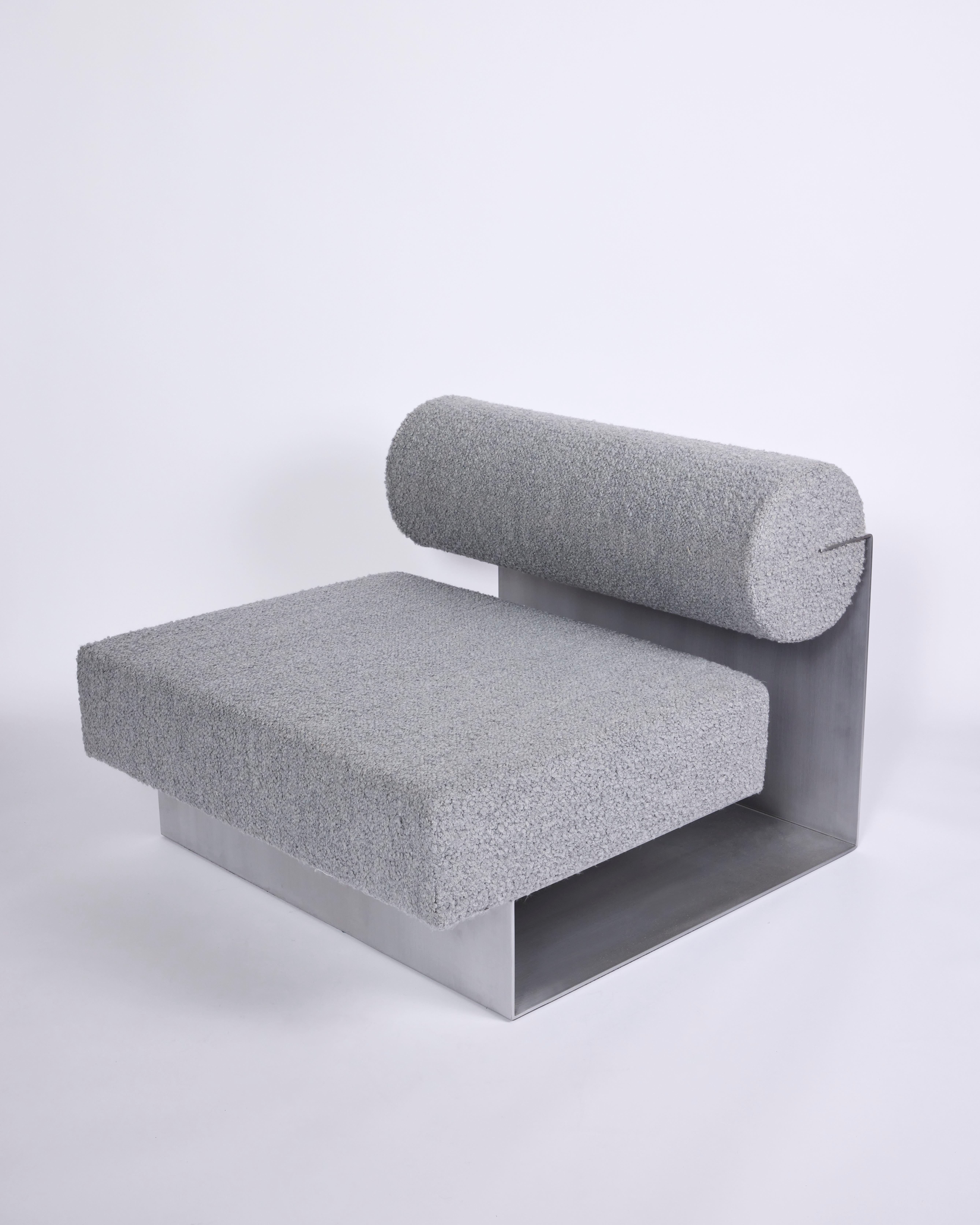 Folds Single Sofa

Materials: aluminum, boucle upholstery
Dimensions: W35 x D38 x H27.5 inches

Folds single sofa explores the dichotomies between hard and soft with thin metal sheets and plush cushions. Pairing back the non-essential elements,