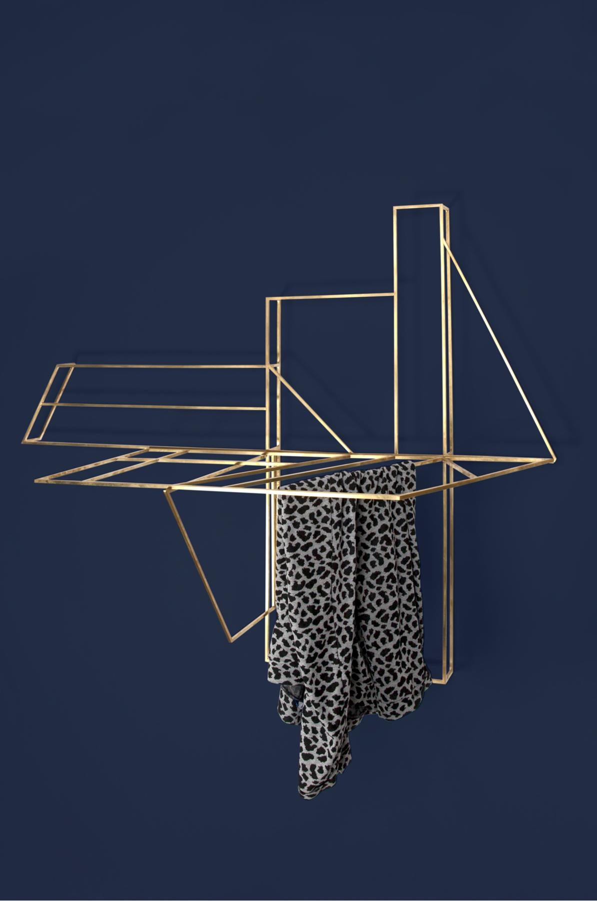 The FOLDWORK RACK is a crossbreed between a wall piece, inspired by half-timbered constructions, and a clothes horse. It hangs on the wall and can be unfolded to provide more space for the laundry. The initial idea for the FOLDWORK collection was to