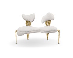 Folia Loveseat in brass gold structure and soft white fabric