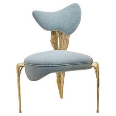 Folia - Silla escultórica de latón con forma orgánica y acabado dorado