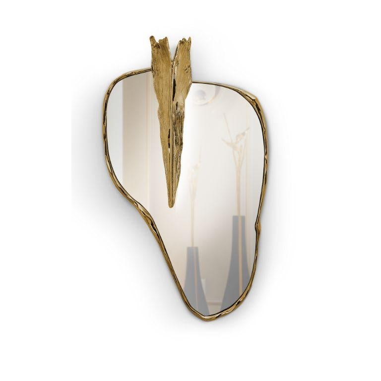 Introducing the Folia Wall Mirror, a polished brass masterpiece that transcends its reflective function to become a centerpiece of elegance and sophistication in your home decor. This mirror is more than just a reflective surface; it is a statement
