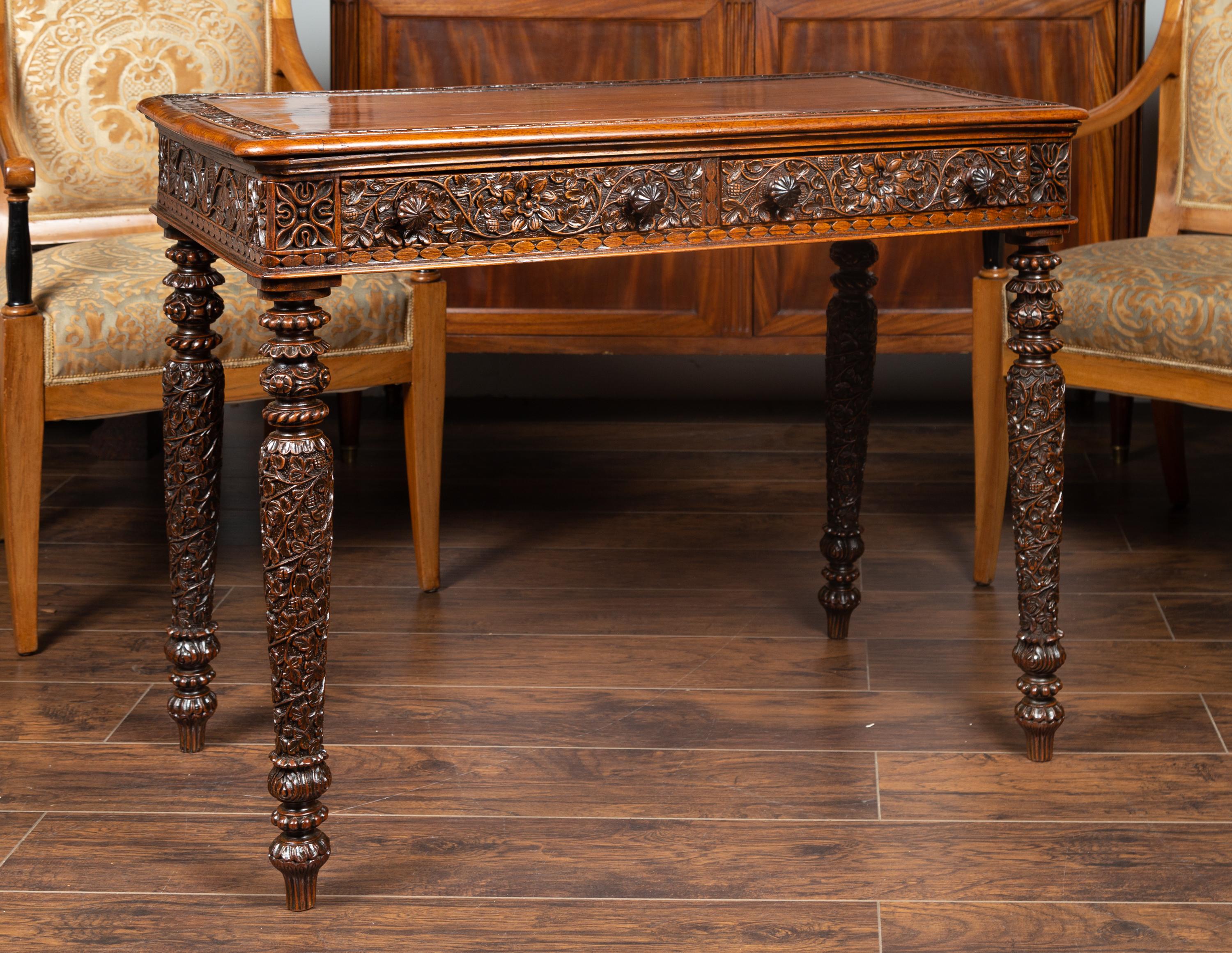 20th Century Foliage Carved 1900s Anglo-Indian Table with Two Drawers and Turned Legs