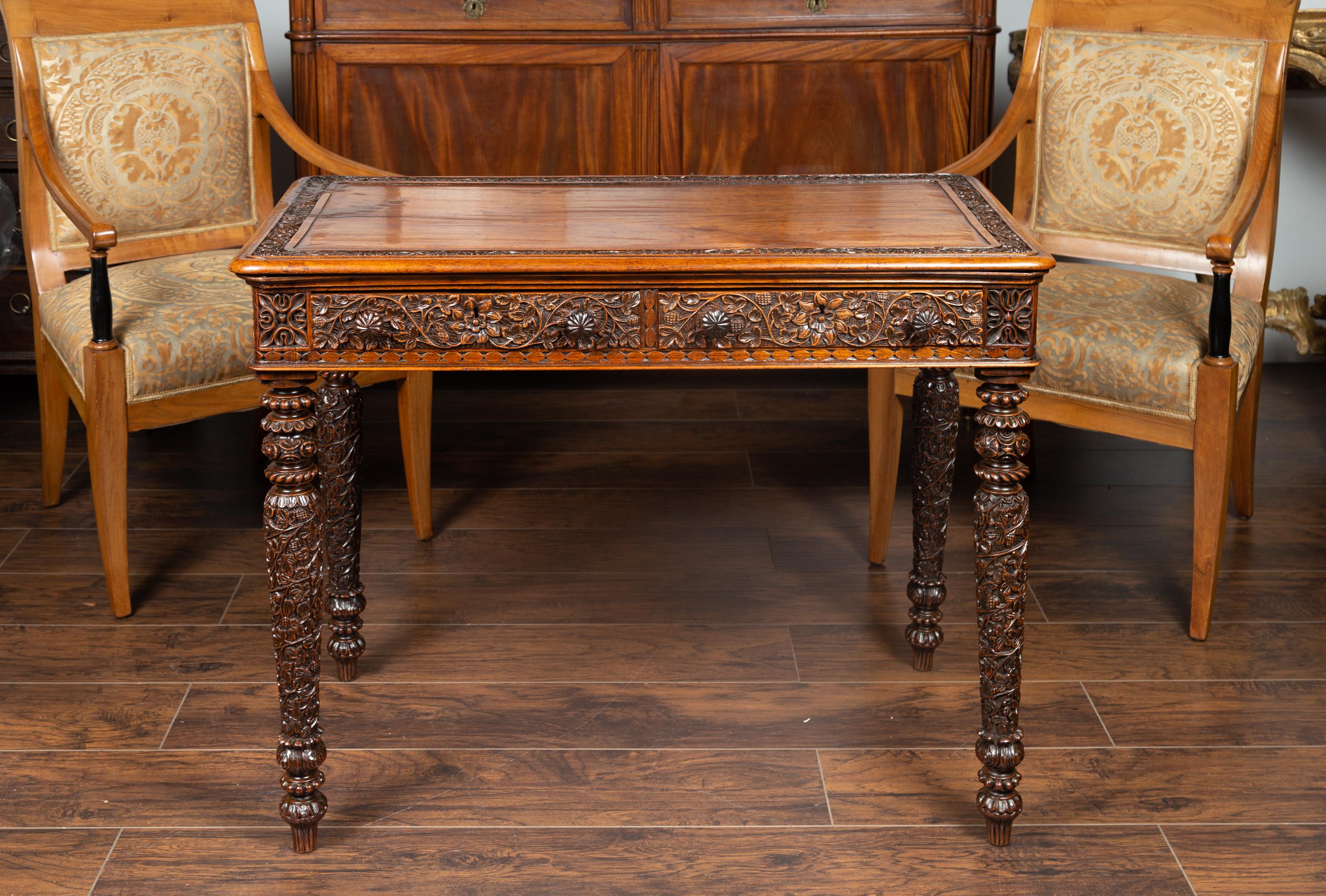 Oak Foliage Carved 1900s Anglo-Indian Table with Two Drawers and Turned Legs