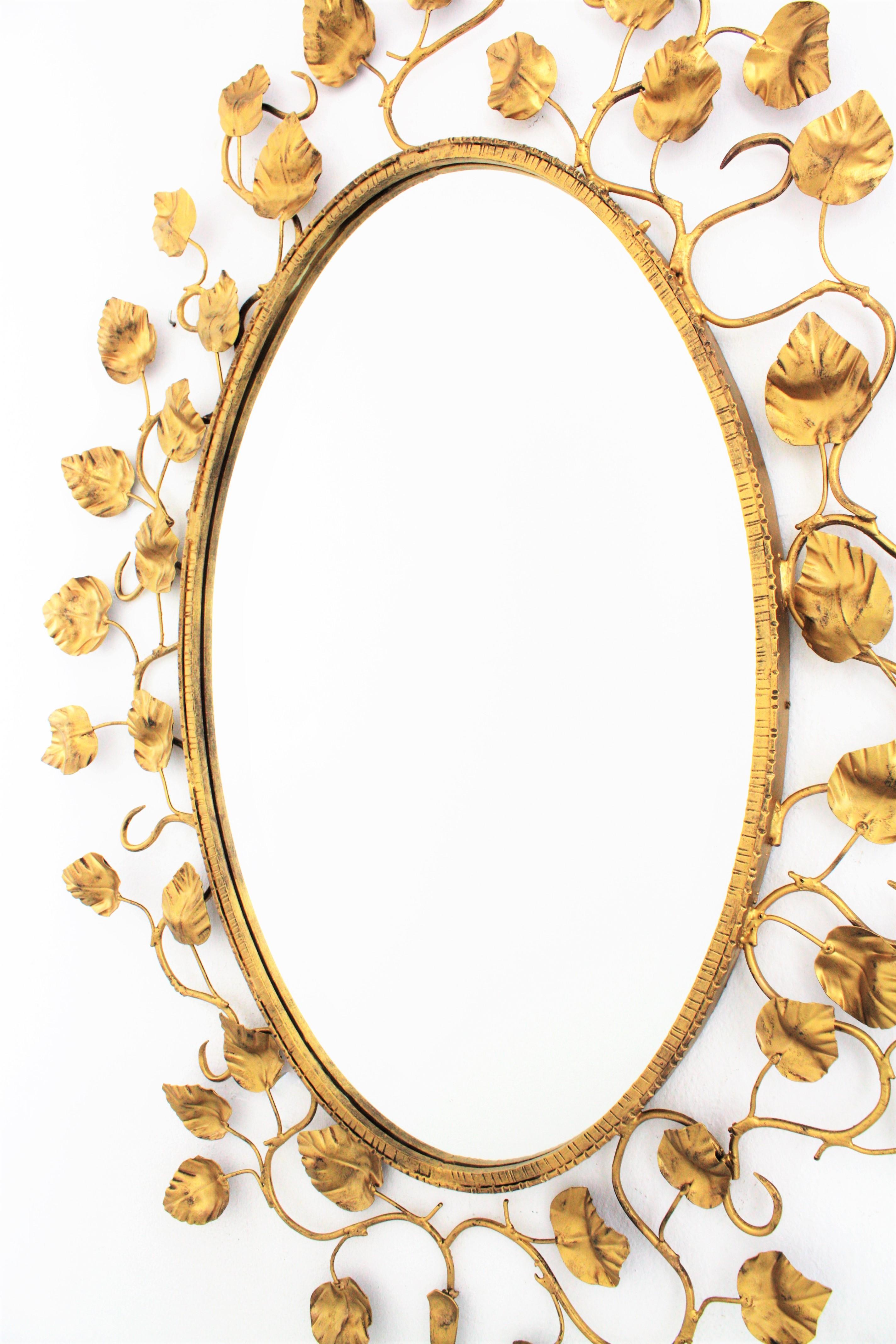 Metal Spanish Large Oval Mirror in Gilt Iron Foliage Frame, 1950s For Sale