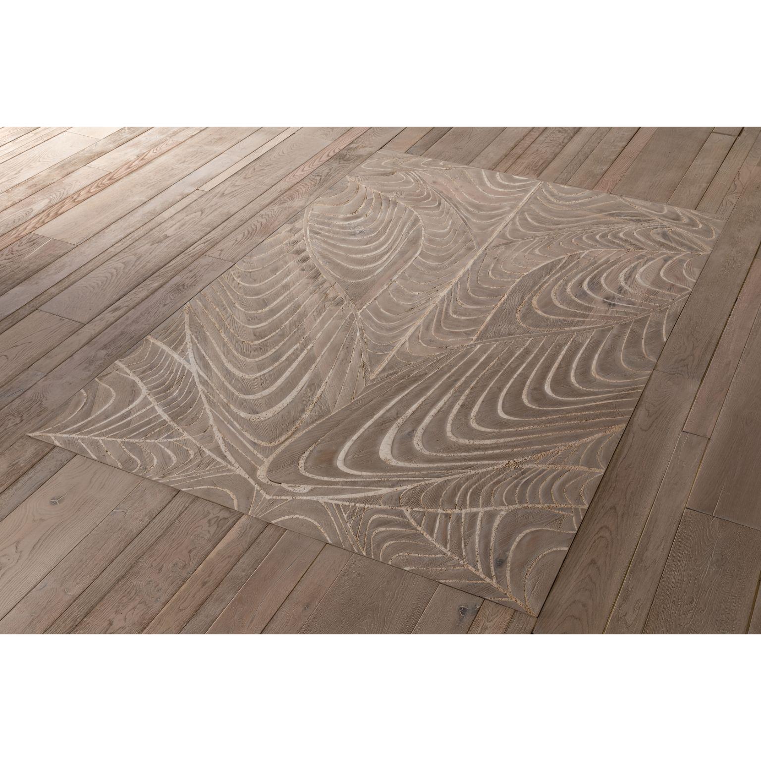 Foliage rug sculpted by Francesco Perini
Materials: Travertine on oak (composed by 2 pieces)
Dimensions: H 4 x W 200 x D 300 cm

Following a creative path that grew out of the founding of a company, I Vassalletti, known the world over for its
