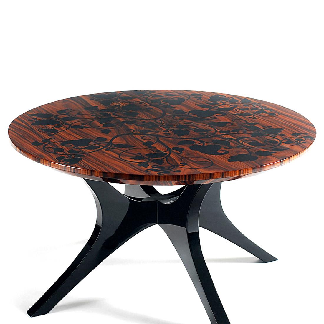 Side table foliage with black lacquered palisander 
base and with solid mahogany top with marquetry.