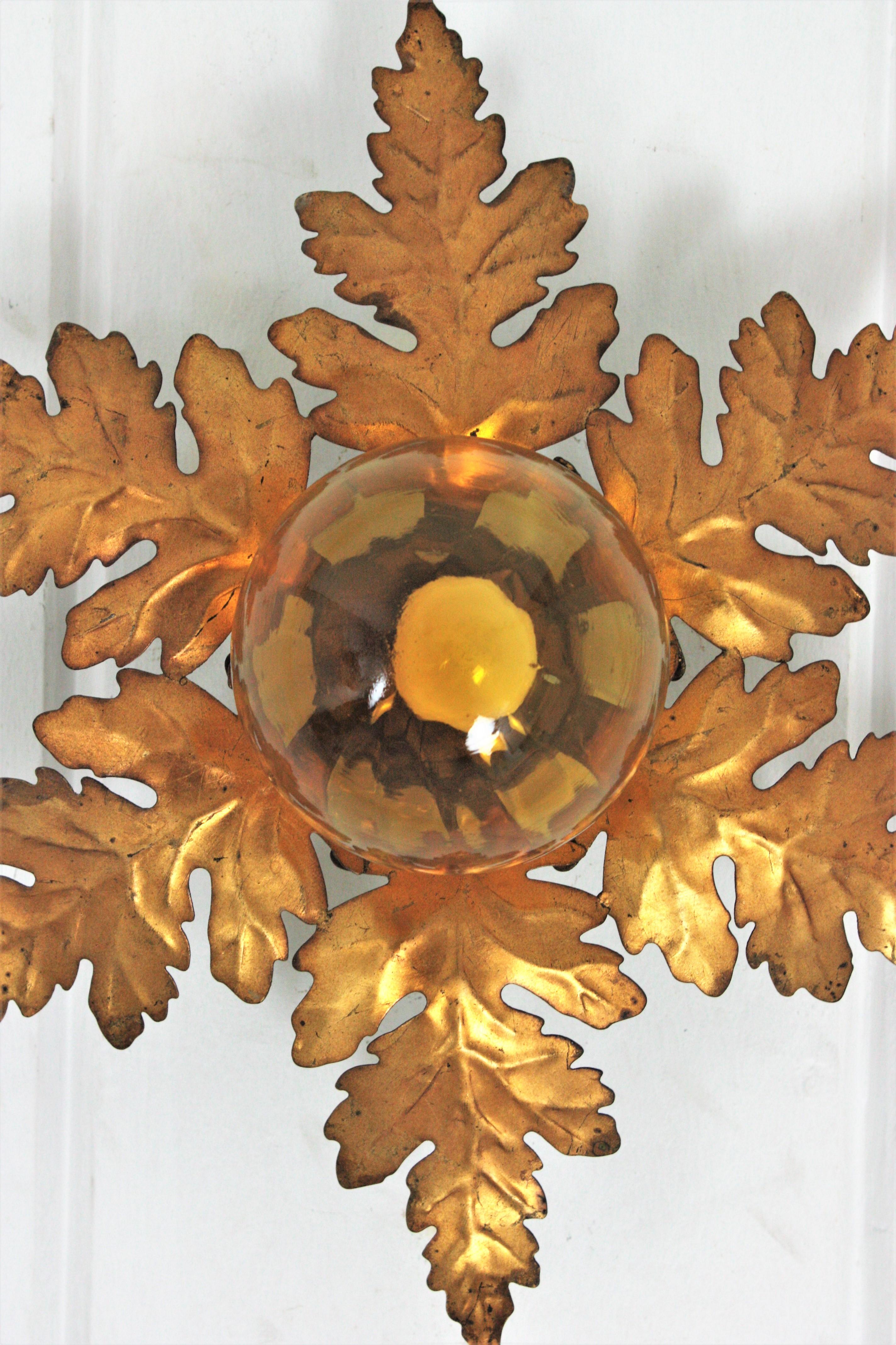 Foliage Sunburst Light Fixture in Gilt Iron with Amber Glass Globe In Good Condition In Barcelona, ES
