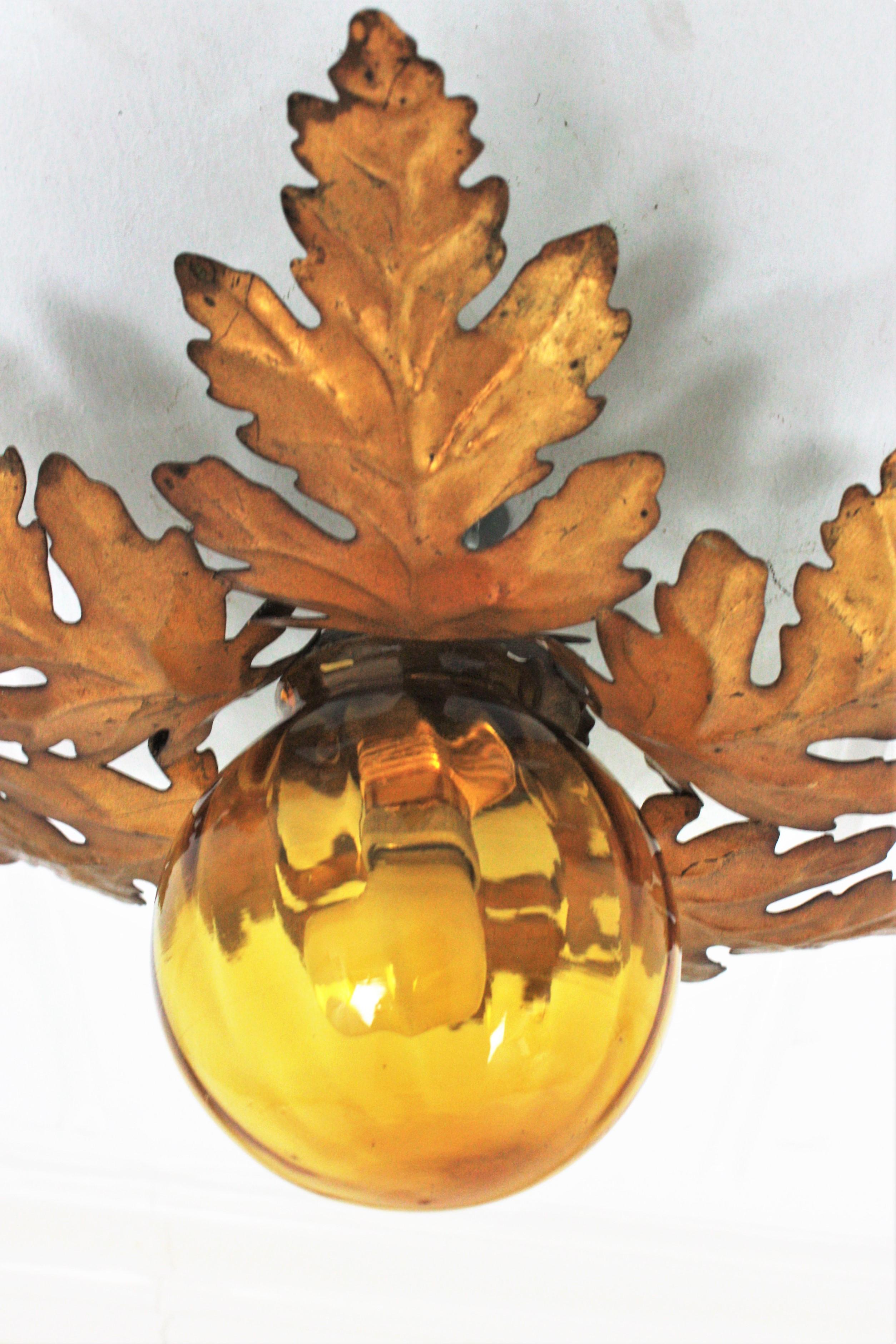 20th Century Foliage Sunburst Light Fixture in Gilt Iron with Amber Glass Globe