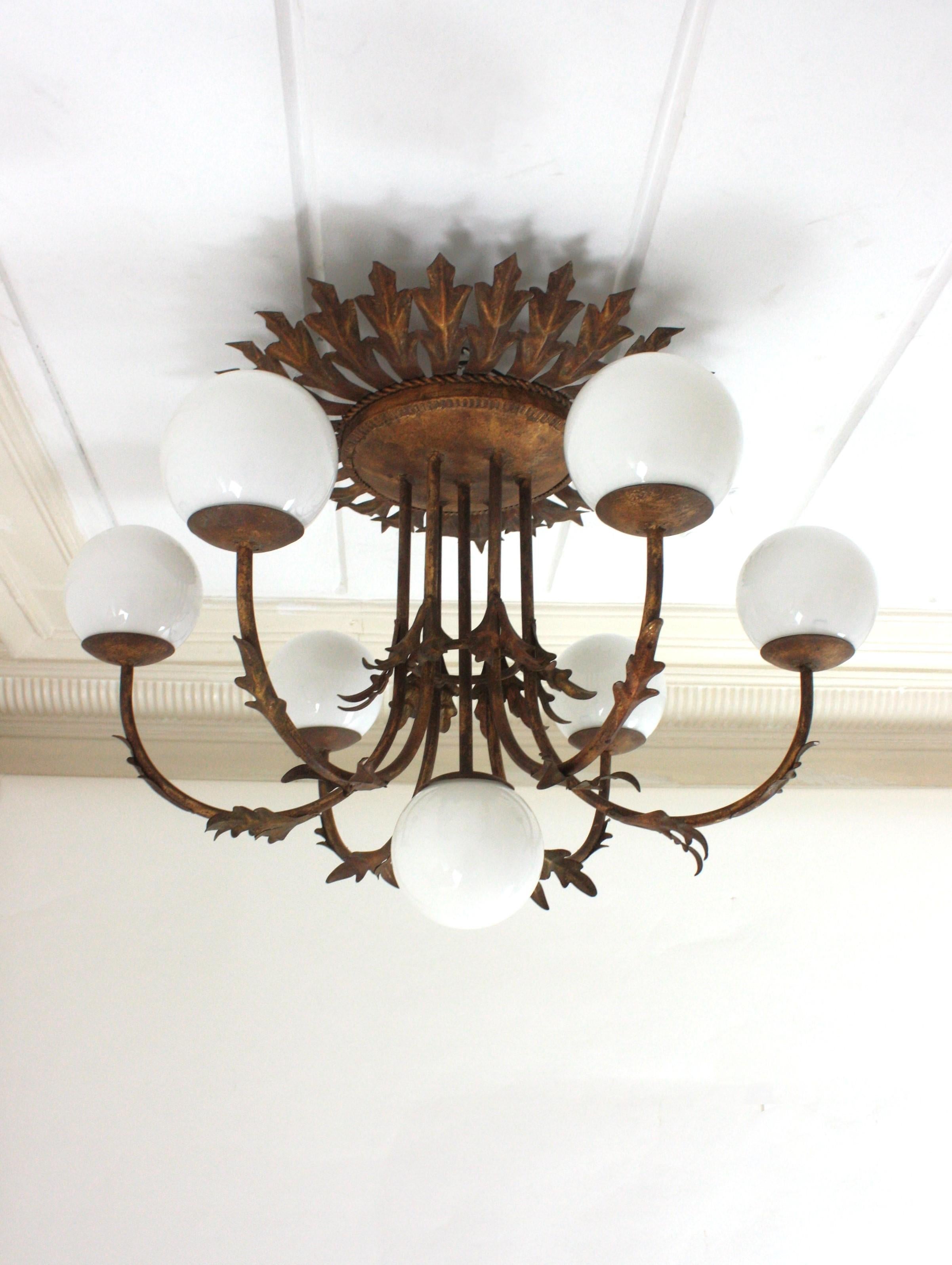 Spanish Foliage Sunburst Opaline Globe Chandelier / Ceiling Light, Gilt Iron, 1950s For Sale