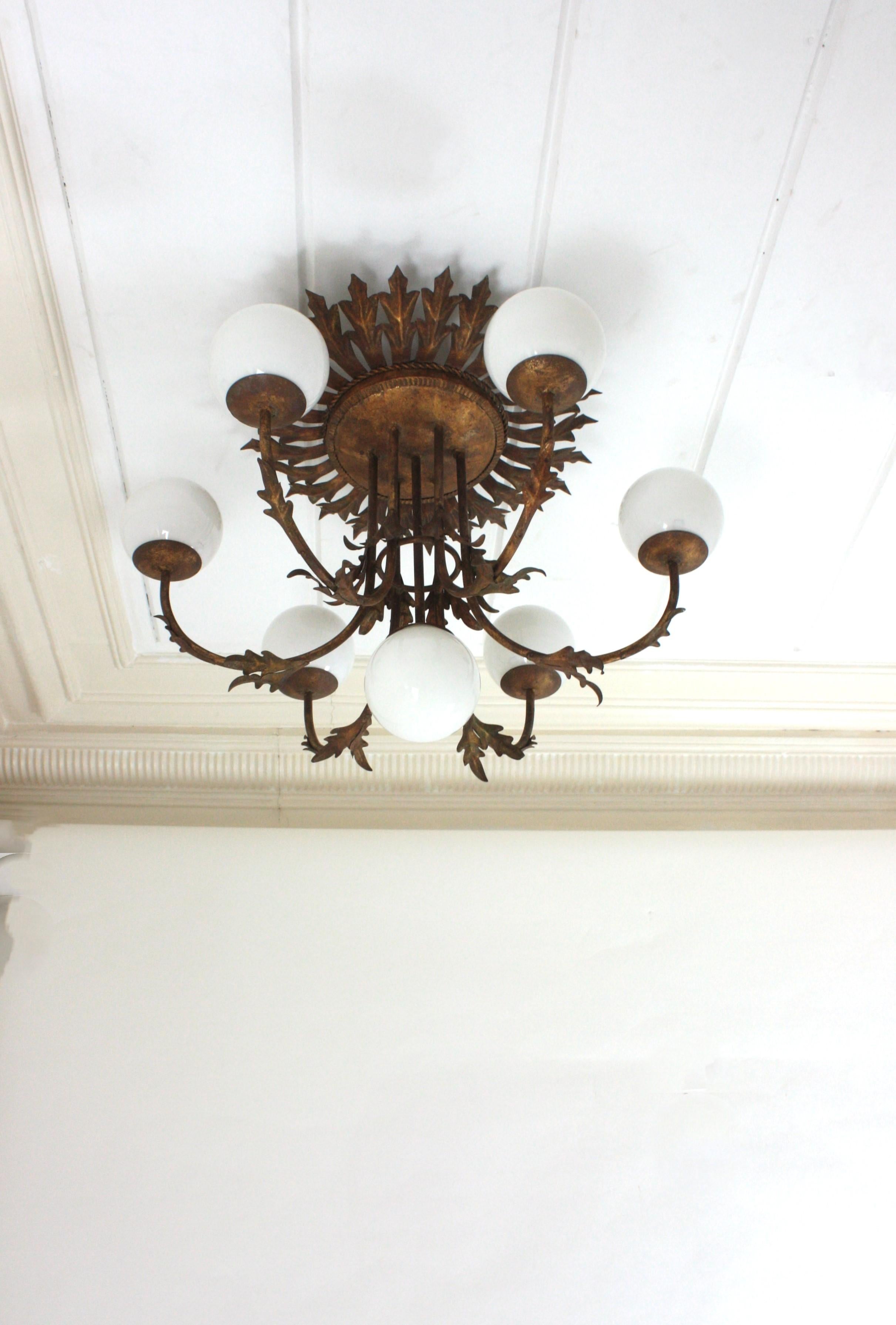 Foliage Sunburst Opaline Globe Chandelier / Ceiling Light, Gilt Iron, 1950s In Good Condition For Sale In Barcelona, ES