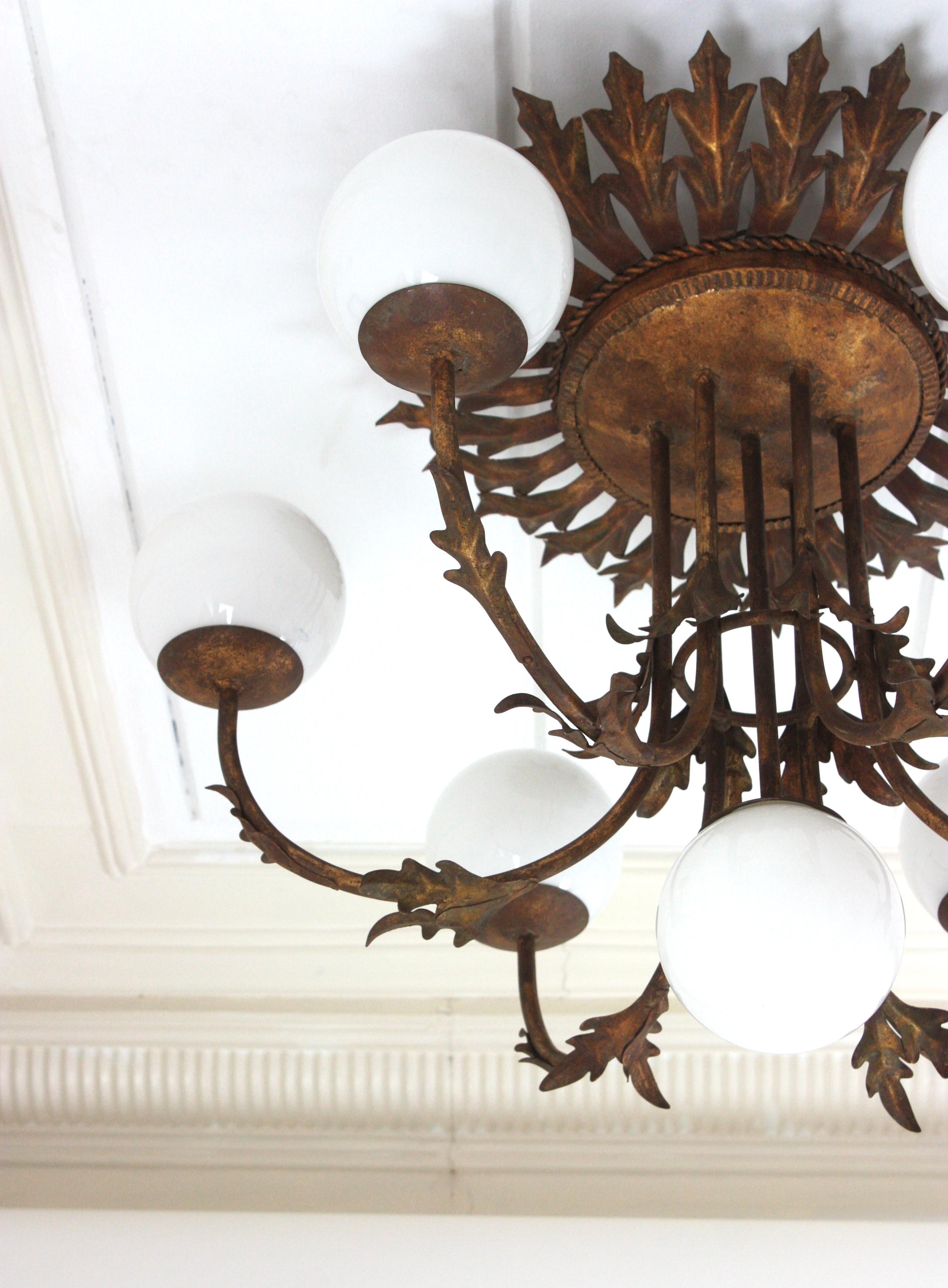 Metal Foliage Sunburst Opaline Globe Chandelier / Ceiling Light, Gilt Iron, 1950s For Sale