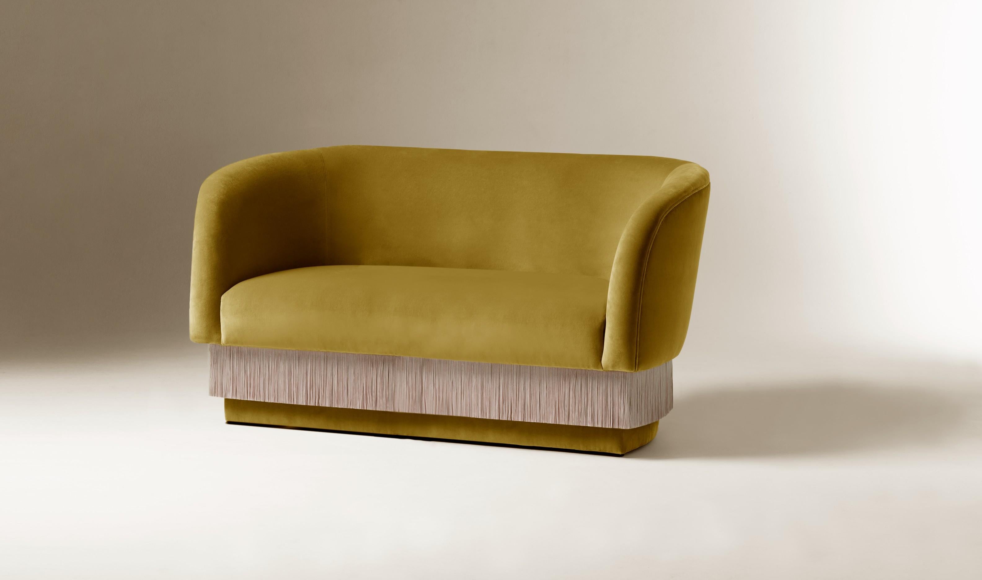 Folie armchair by Dooq
W 180 cm 55” (also available in 140cm, or made to order in other dimensions)
D 85 cm 33”
H 75 cm 30”
Seat height 42 cm 17

Materials: upholstery and piping fabric or leather, fringes.

Dooq is a design company