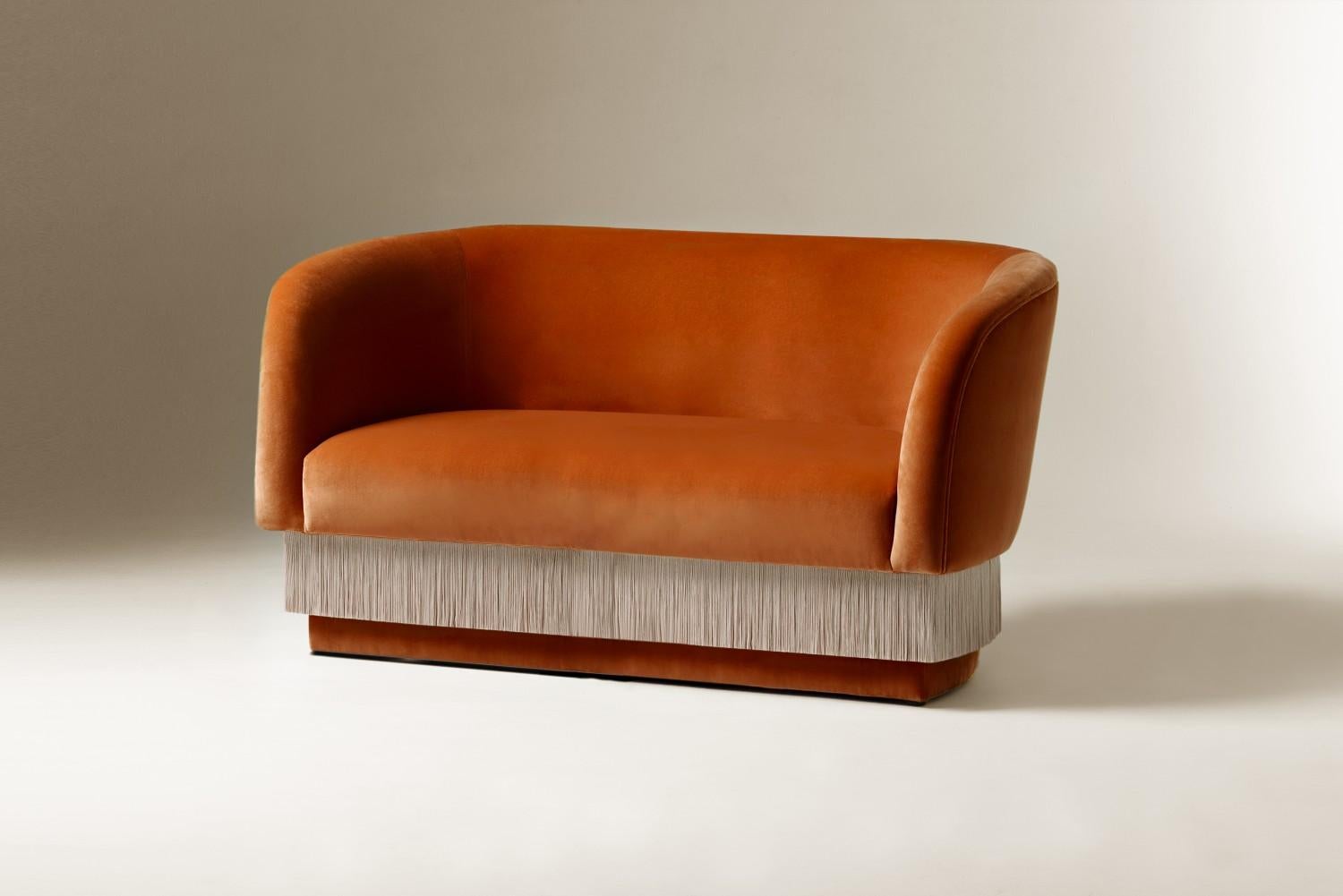 Folie sofa by Dooq
Measures: W 140 cm 55” (also available in 180cm, or made to order in other dimensions)
D 85 cm 33”
H 75 cm 30”
Seat height 42 cm 17

Materials: Upholstery and piping fabric or leather, fringes.

Dooq is a design company