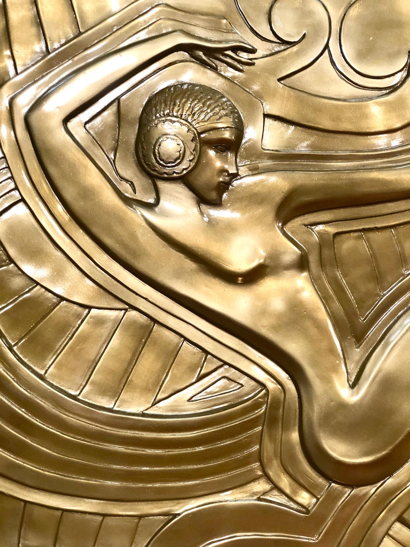 Golden wall plaque made after the model that decorates the facade of the revue theater “Folies Bergère” in Paris. This meter-high relief dates from 1926, by the French architect and designer “Maurice Picaud”, called “Pico”. The depicted dancer could