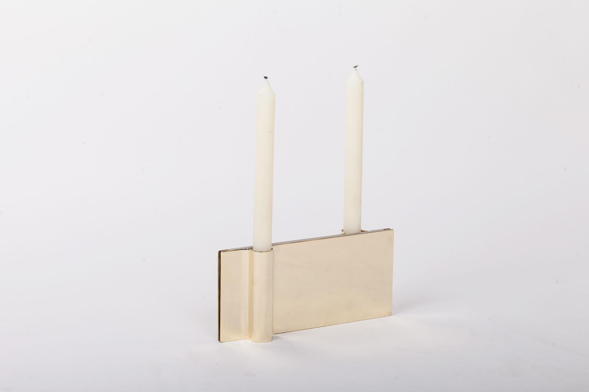 Folio brass candle holder by Mingardo
Dimensions: D22.5 x W2.2 x H11 cm 
Materials: polished natural brass
Weight: 1.5 kg

Also available in Different finishes: Polished natural copper, Polished natural brass, Polished natural stainless