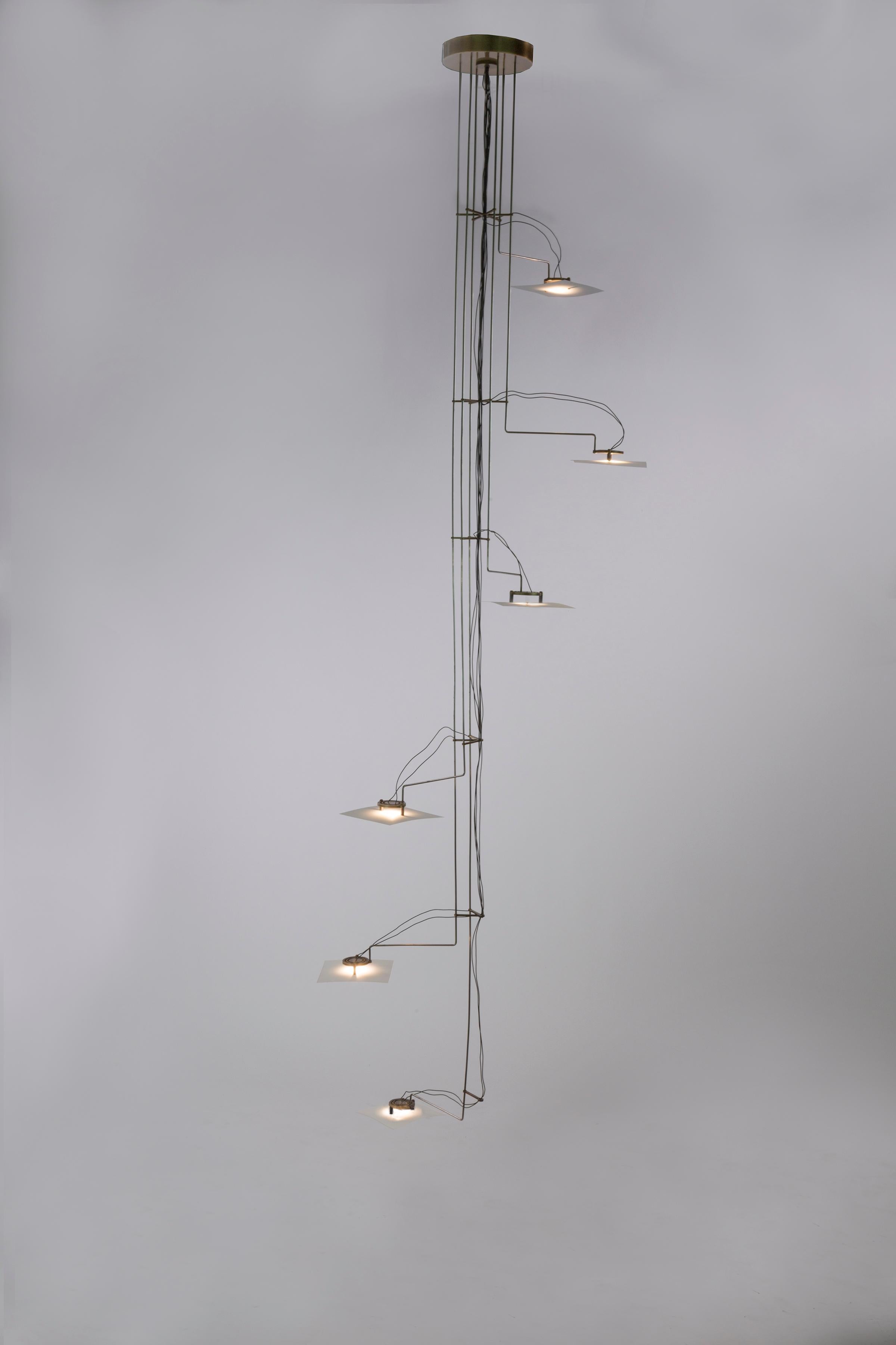 Folio chandelier by Gentner Design
Dimensions: D 48 x W 48 x H 193 cm
Materials: hand rubbed brass, diffuser paper

All our lamps can be wired according to each country. If sold to the USA it will be wired for the USA for instance.

Visually