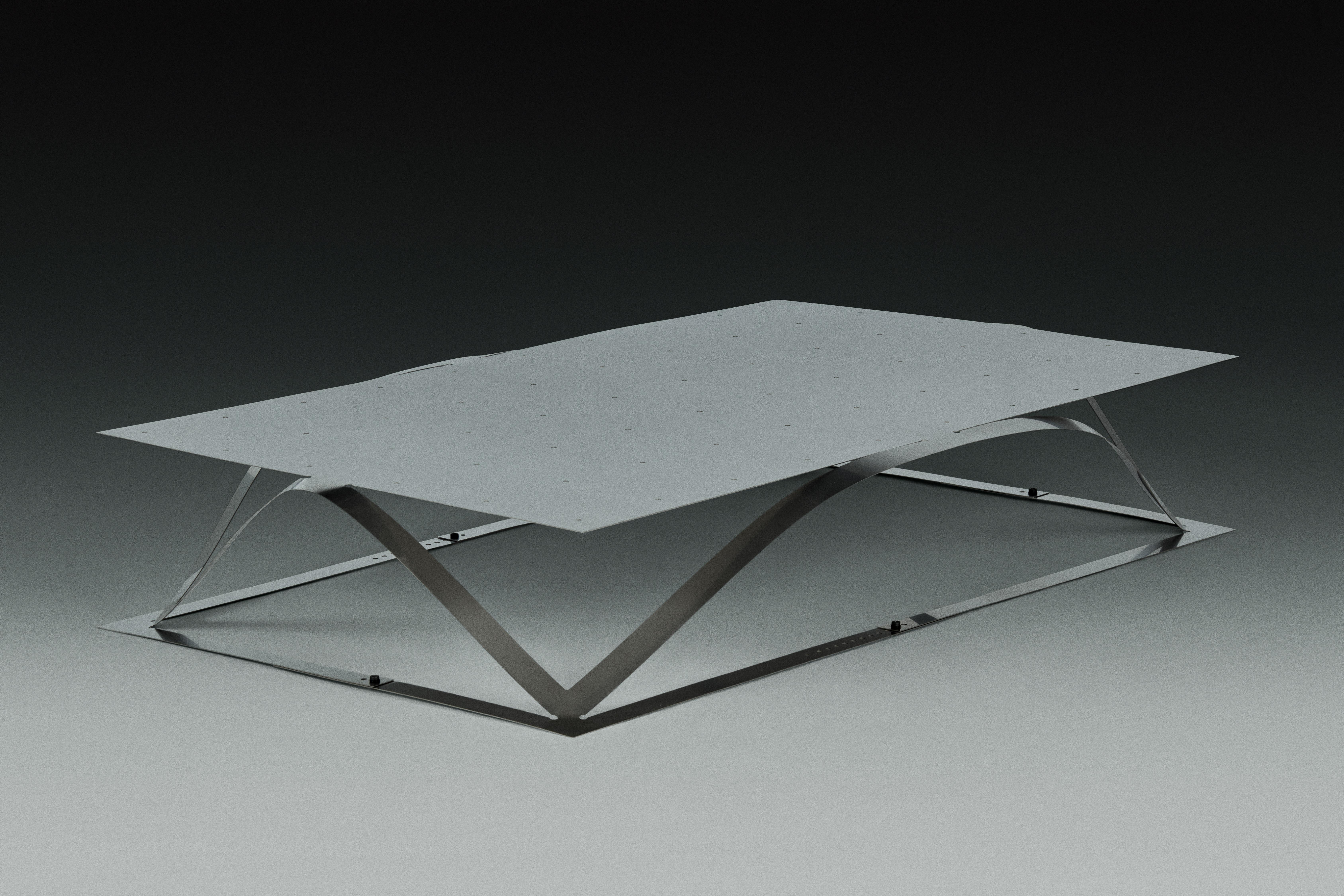 Folio Coffee Table by Kutarq Studio
Materials: Stainless steel.
Dimensions: D 99 x W 22 x H 23 cm

The FOLIO coffee table explores the physical properties of steel, taking on the visual appearance of bent paper.
Planar laser-cuts render a 2D sheet
