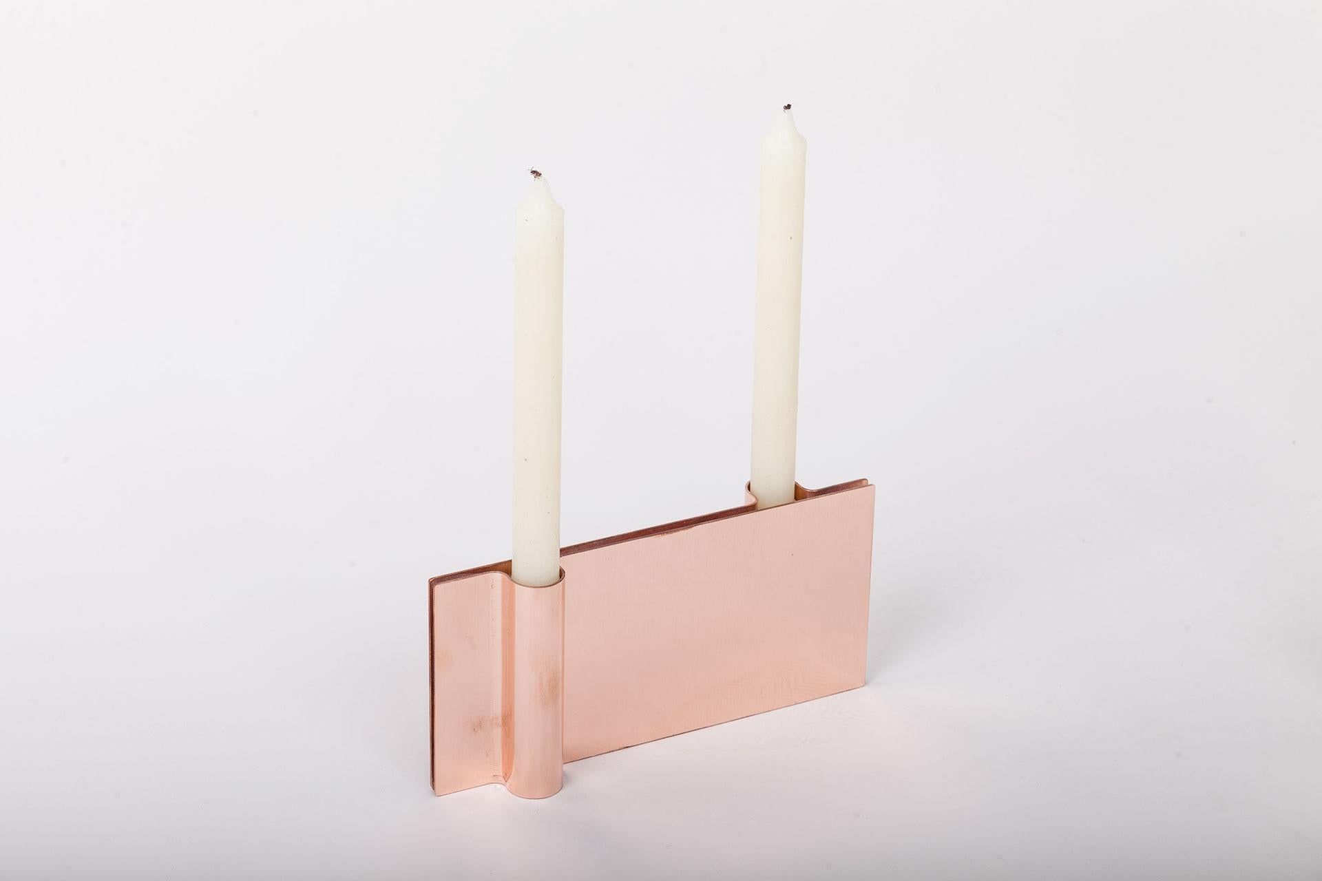 Folio candle holder by Mingardo
Dimensions: D22.5 x W2.2 x H11 cm 
Materials: polished natural copper.
Weight: 1.5 kg

Also available in different finishes: Polished natural copper, Polished natural brass, Polished natural stainless
