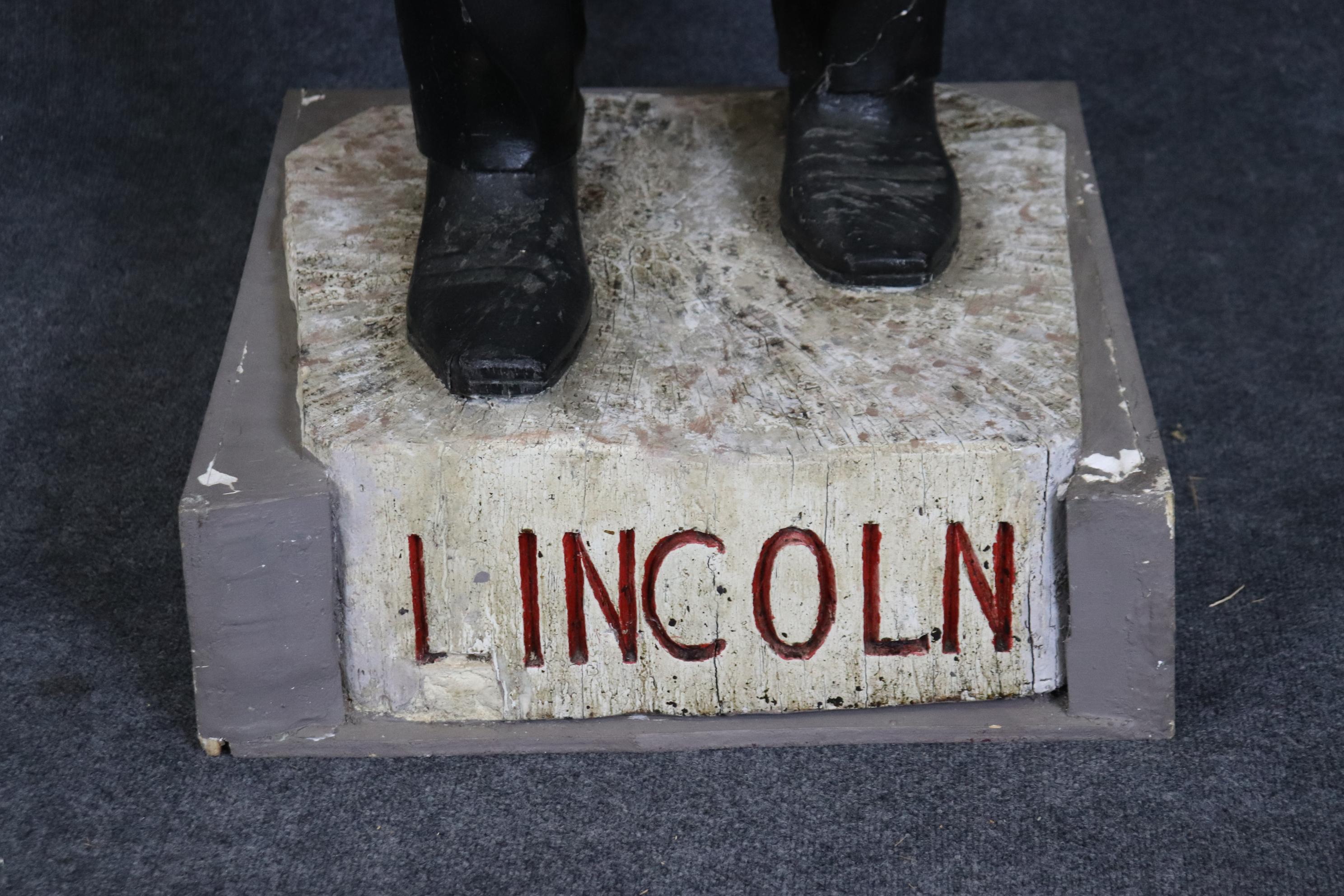 This is a very large, larger than life, folk art or primitive carved statue of Abraham Lincoln. The piece looks like it was made by a naive artist and was from a northern New Jersey estate and dates to the 1880-90s era. The painted finish is in good