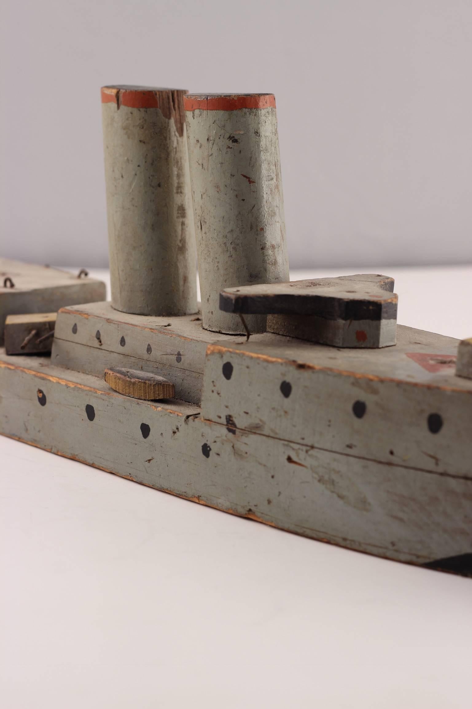A piece of social history from the end of the Second World War. This Toy Folk Art Battle Ship was made towards the end of the Second World War by an Italian prisoner of war and has been passed down through generations of an English Family. It is