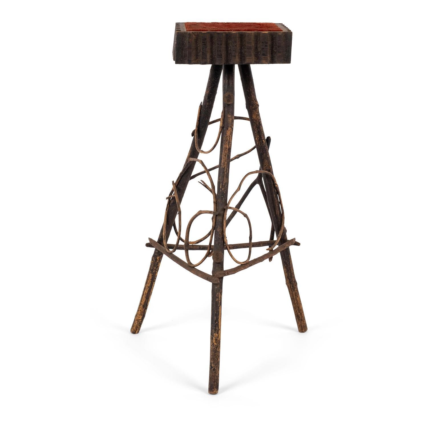 Antique Folk Art twig stand with original red color upholstered top surrounded by hand carved edge.

Note: Regional differences in humidity and climate during shipping may cause antique and vintage wood to shrink and/or split along its grain, veneer