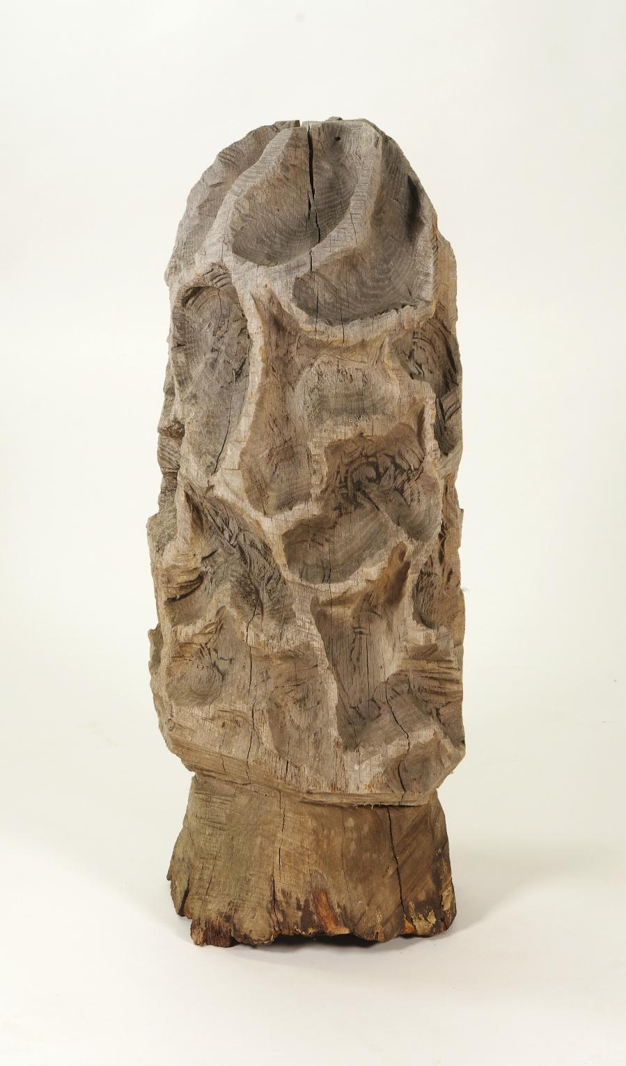 Folk art carved morel mushroom sculpture

The rough, uneven surface of this delightful sculpture suggests it was carved with a chain saw, possibly from a telephone pole.

The base, which has suffered from sitting on the ground, has been filled