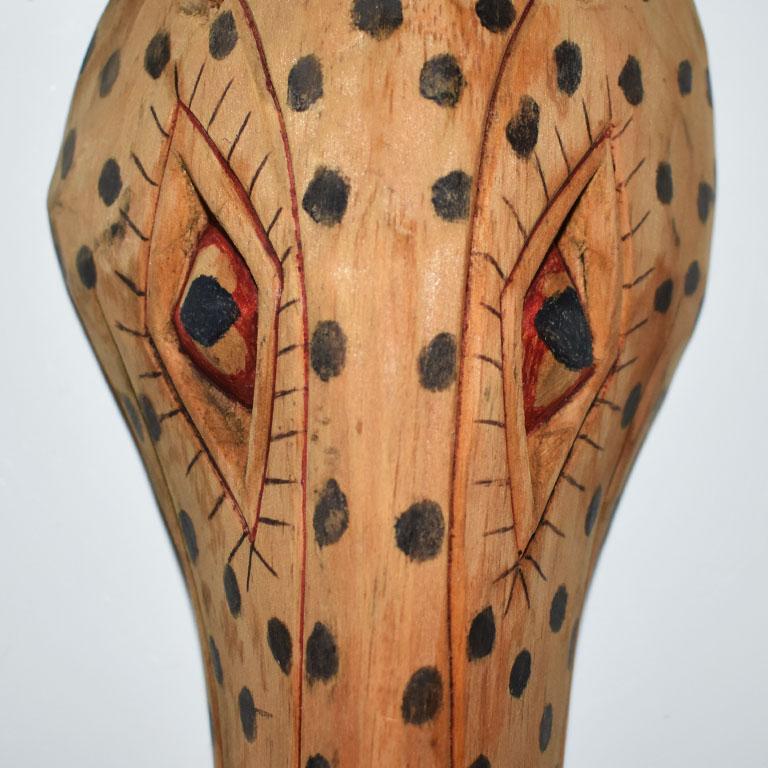 dog faces in wood