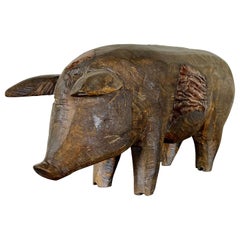 Folk Art Carved Wooden Pig Sculpture with Patinated Finish