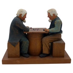 Used Folk Art Carving of 2 Men Playing Checkers on Top of a Barrel by Jack Eichbaum