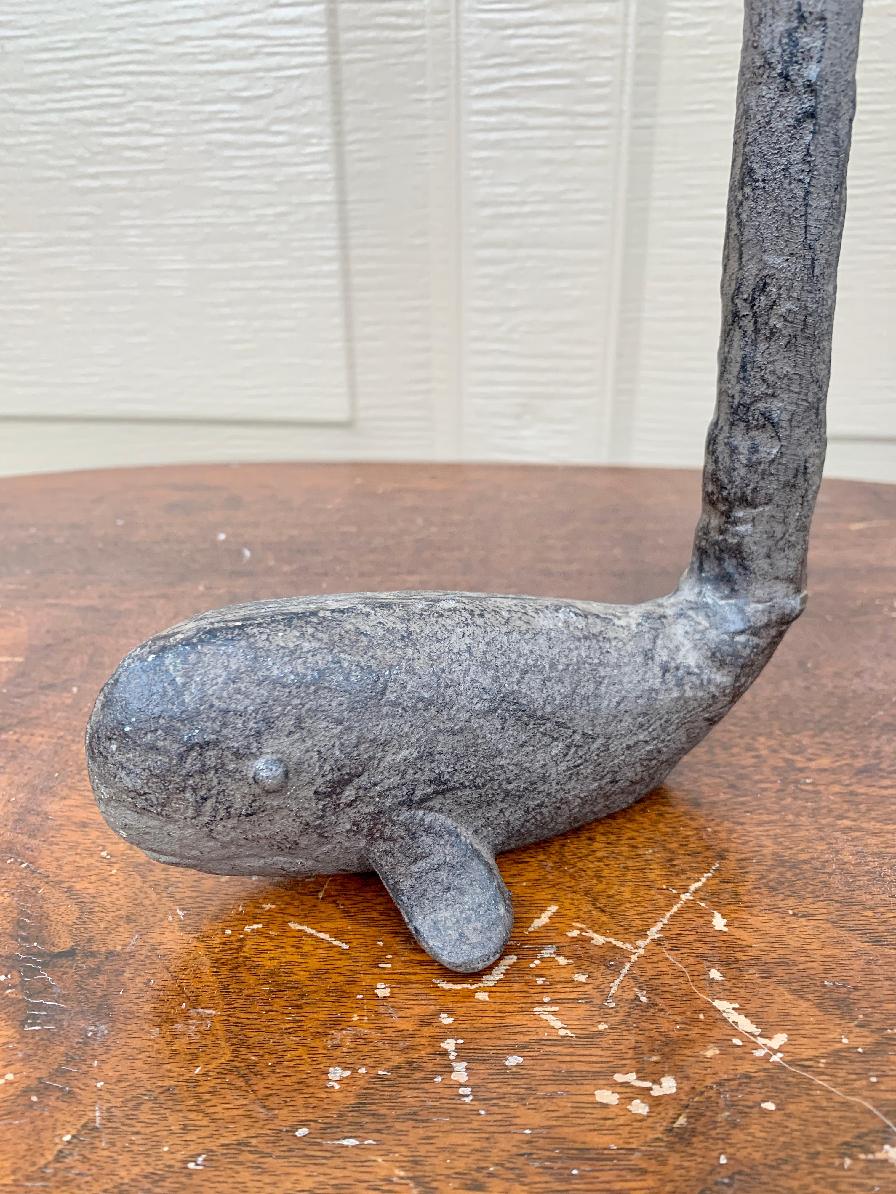 A charming Folk Art cast iron door stop or sculpture in the form of a whale, perfect for your Nantucket, Cape, or Hamptons home! 

USA, 20th Century

Measuers: 6.25
