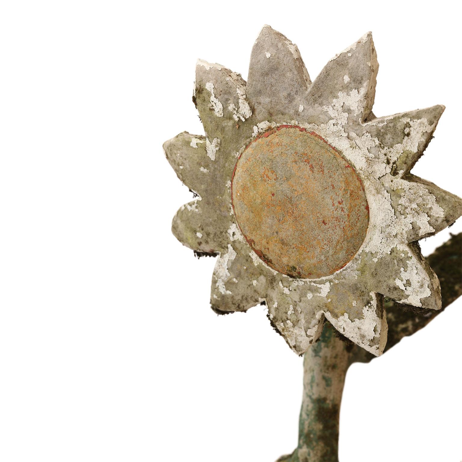 Folk Art cement sunflower: tall whimsical sunflower sculpture crafted by unknown French folk artist, circa 1940-1969. Incredible patina includes remnants of weathered paint and moss.