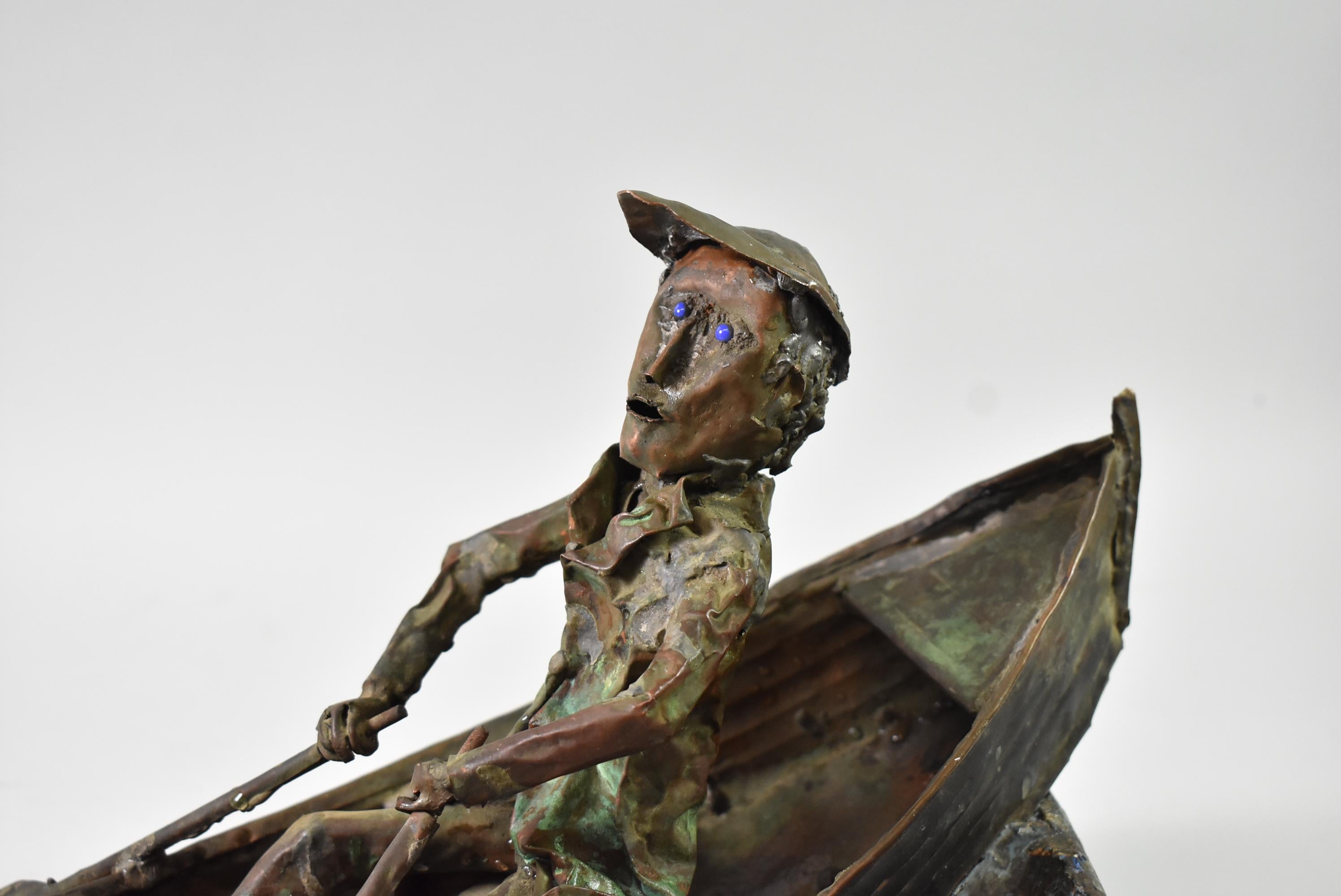 Unique Folk Art copper sculpture of a man in a rowboat by S. J. Rossbach circa 1966. 