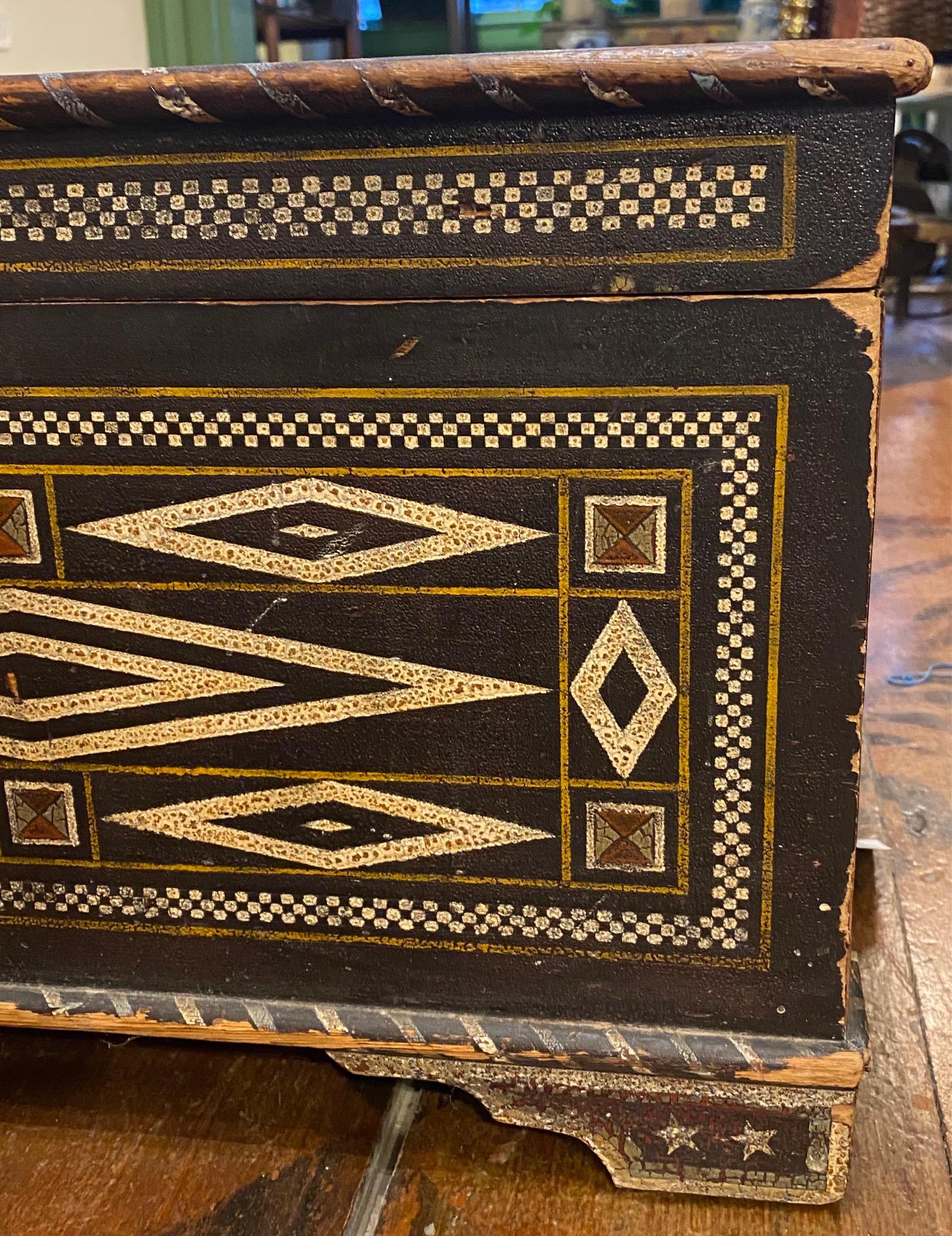 Vintage Folk Art Decorated Wooden Chest or Footlocker, formerly the traveling chest of Big Band and cabaret singer Betty George, circa late 1940s to early 1950s, having an intricate geometric painted decoration reminiscent of the South Seas. The