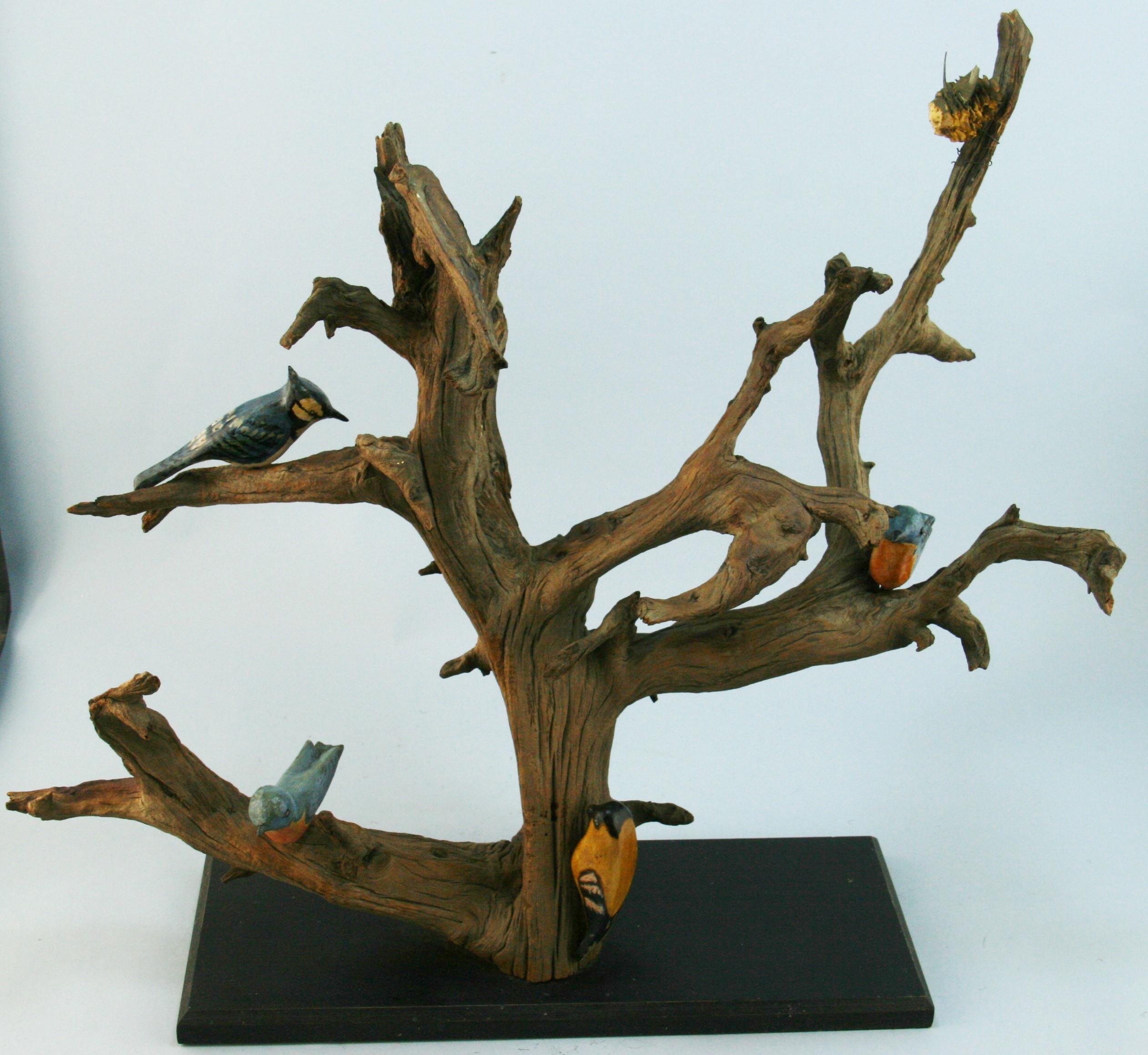 An early twentieth century Japanese whimsical folk art bird tree  driftwood hand carved and painted  bird sculpture.