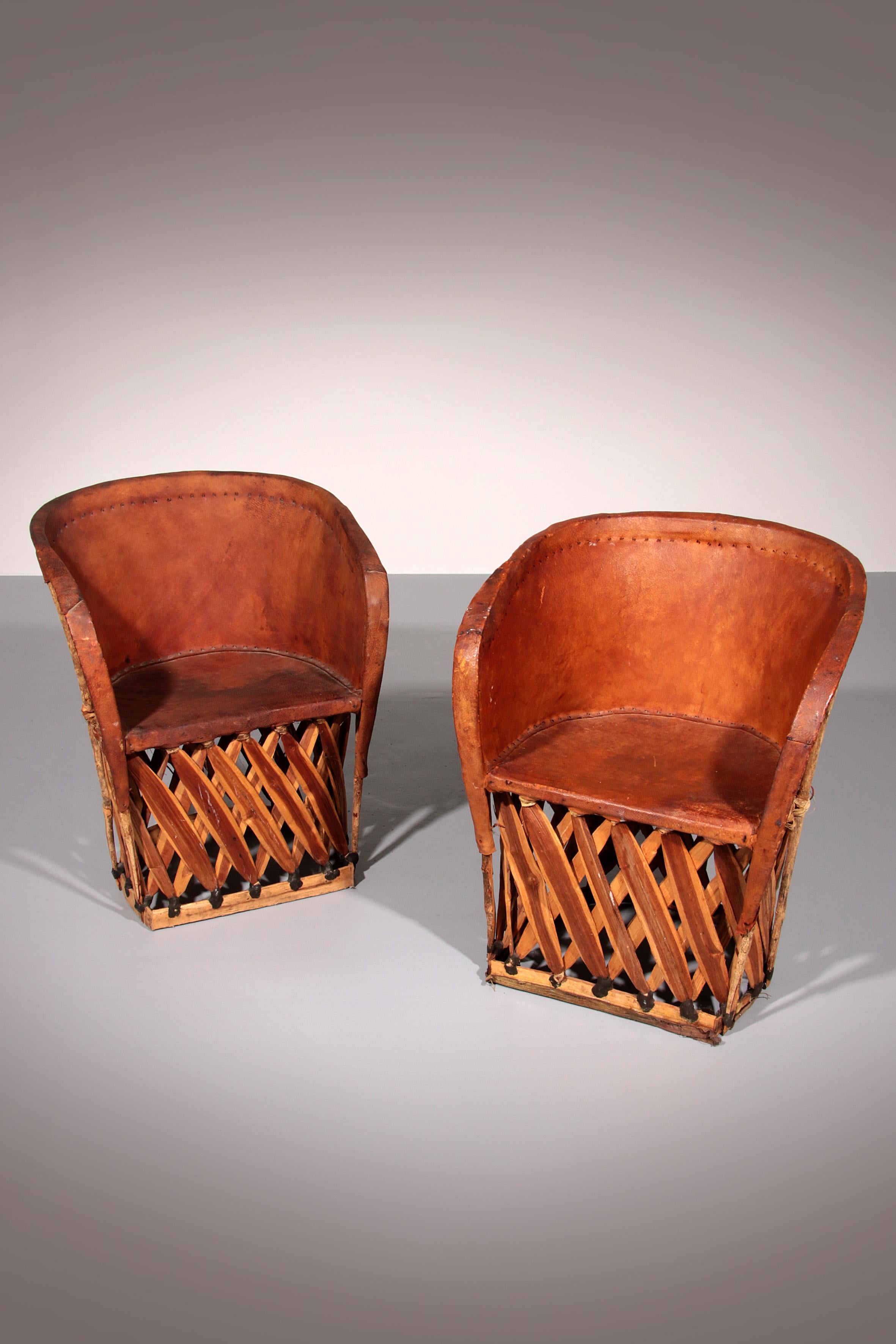 This unique Folk Art chair from 1970s Mexico is a true testament to traditional craftsmanship. Handmade with an intricately woven wooden frame, it is elegantly covered in genuine ostrich leather, offering both durability and an exotic aesthetic.