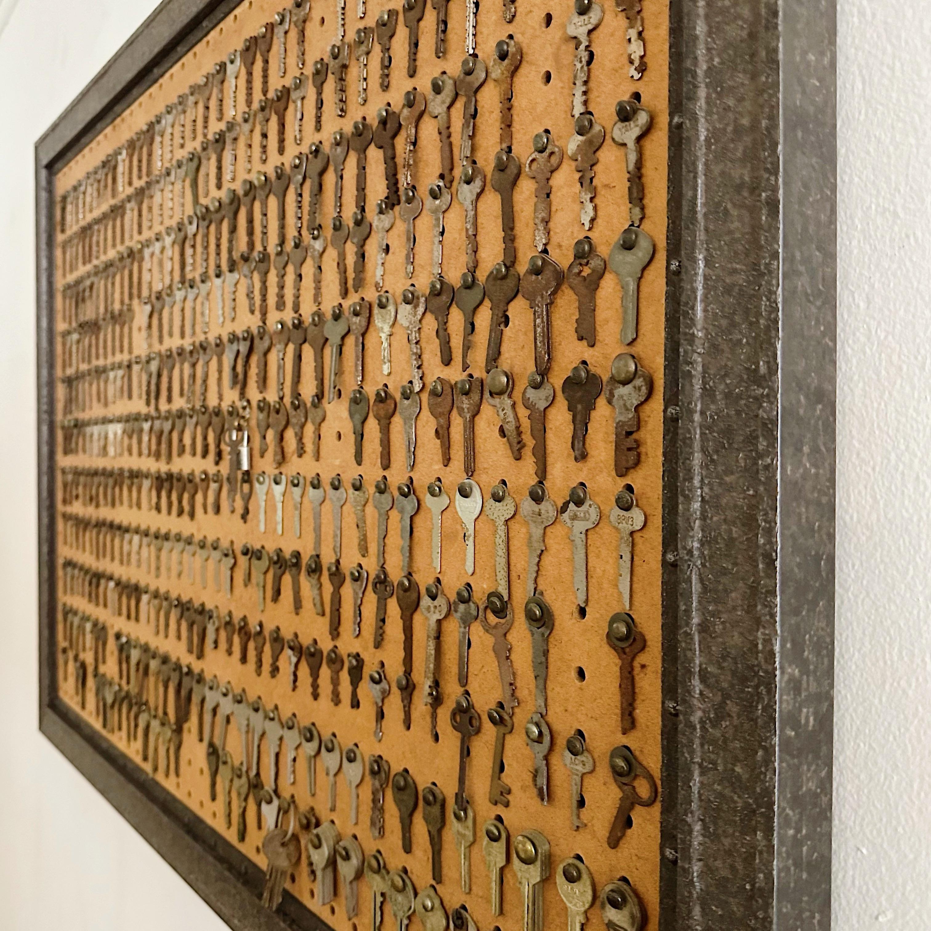Vintage keys on a pegboard attached with round head fasteners. This piece was apparently gifted by parents to their child per the message on the back stating 