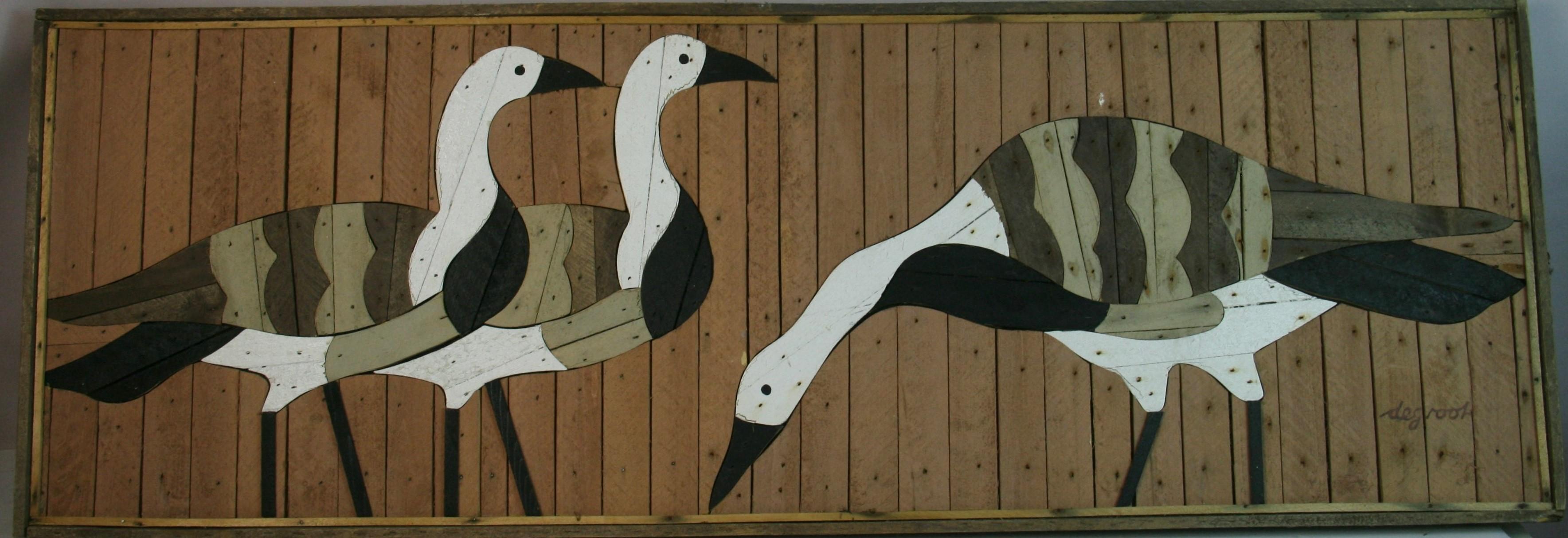 6071 Scultura da parete Folk Art realizzata con vecchi tralicci di legno in gesso intagliati a forma di gruppo di oche e poi dipinti
Firmato Segroot