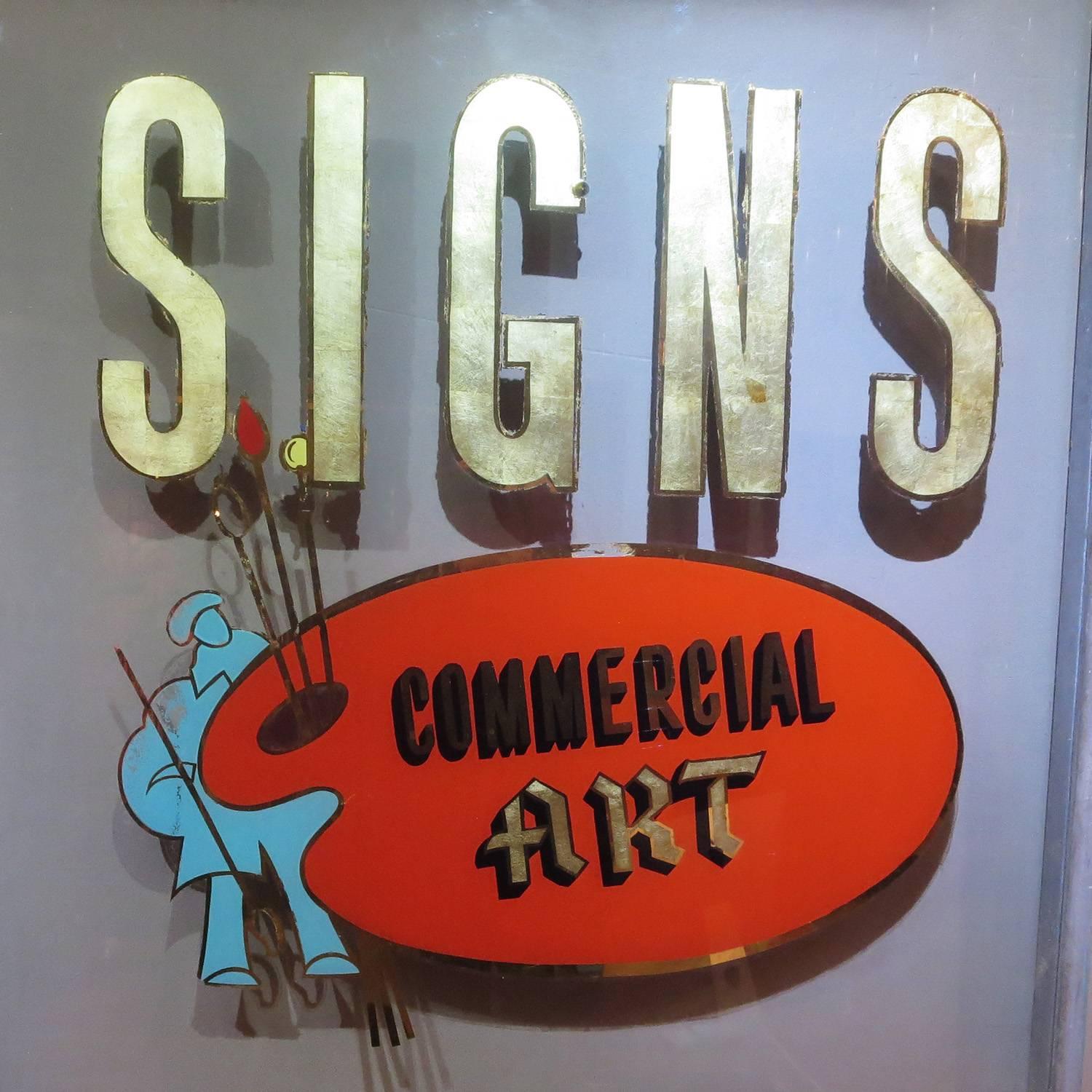 Truly a dying art, the local sign painter has become a thing of the past. This fantastic framed window was an advertisement that hung in a sign painters shop. The large letters are gold leaf, trimmed in gold mirror. The palette and artist are the