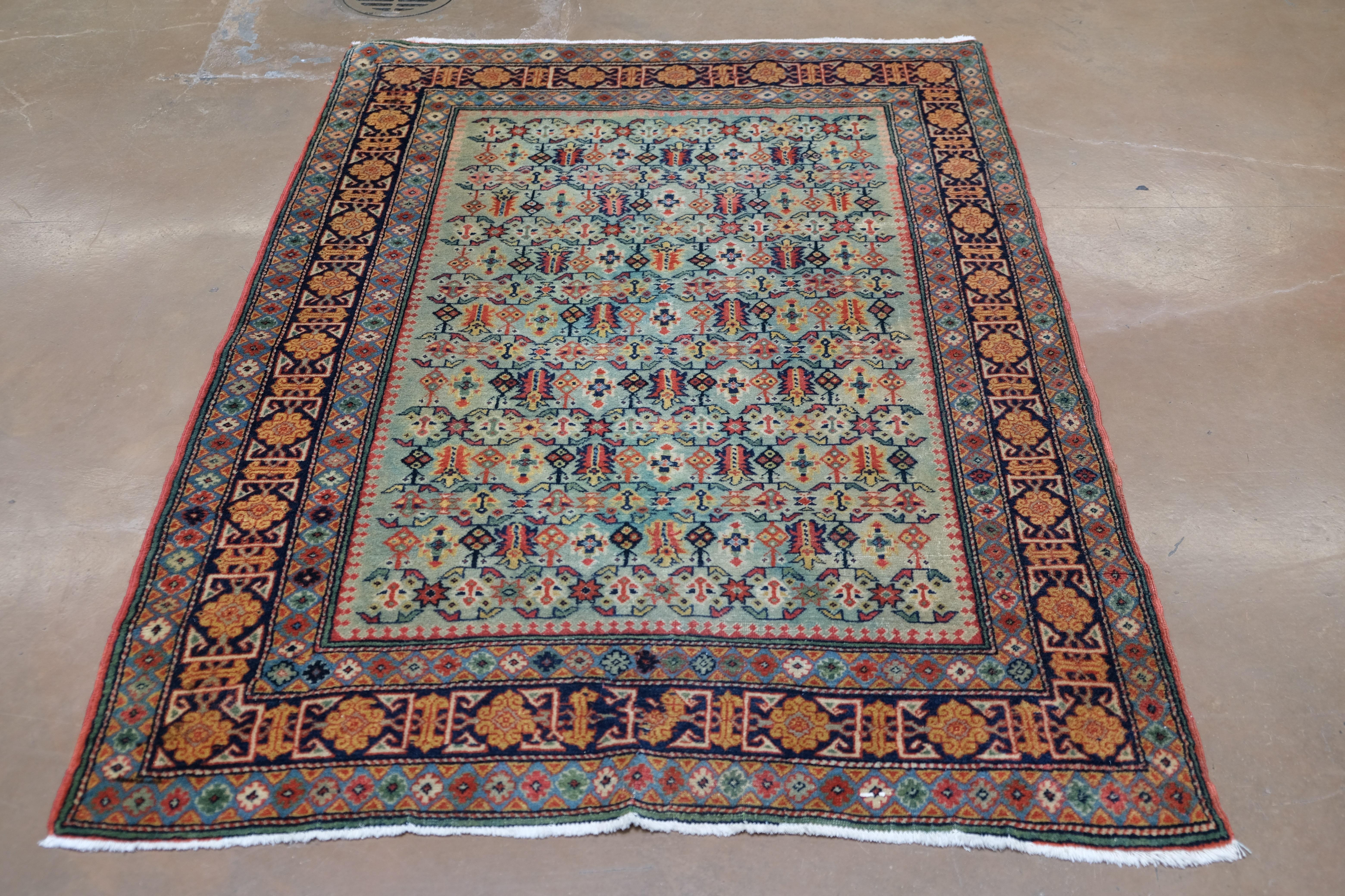 Annodato a mano Tappeto in lana stile Kazak Folk-Art verde, rosso, arancione, giallo e blu 3'7''x5' in vendita