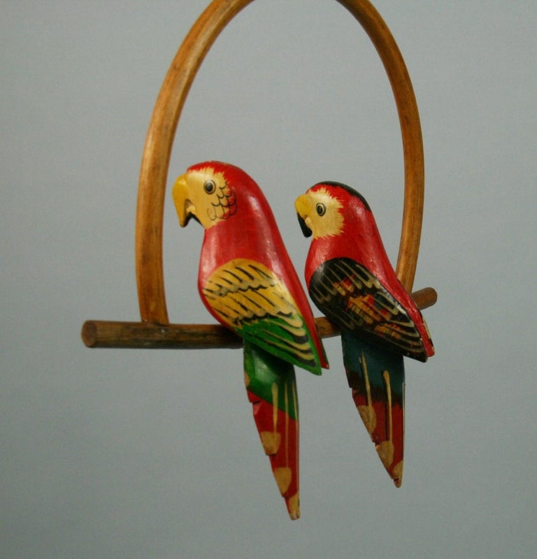 Folk Art Hand Carved and Painted Pair Red Parrots Sculptures on a Swing In Good Condition For Sale In Douglas Manor, NY