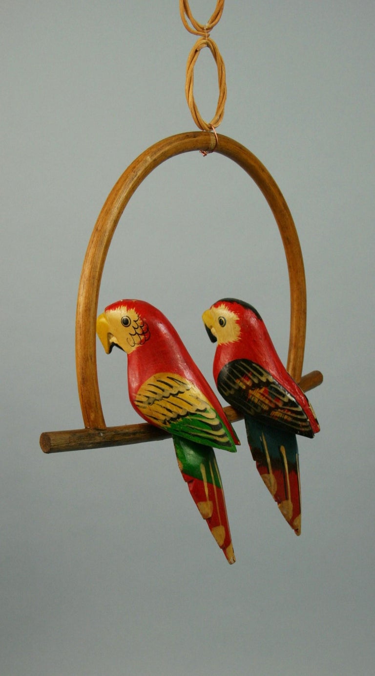 Hardwood Folk Art Hand Carved and Painted Pair Red Parrots Sculptures on a Swing For Sale