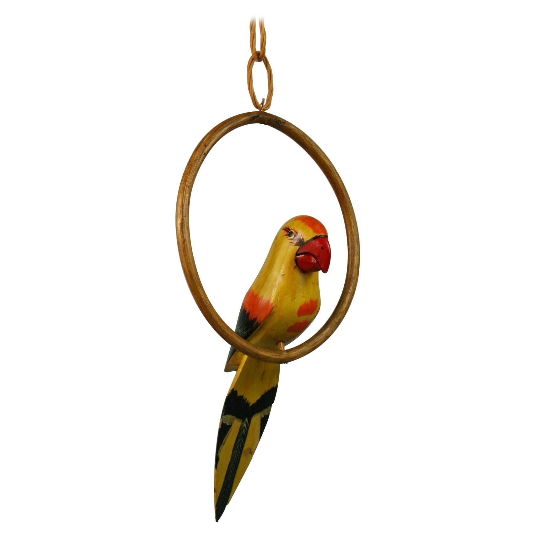 Folk Art Hand Carved and Painted Yellow Parrot Sculpture On a Swing