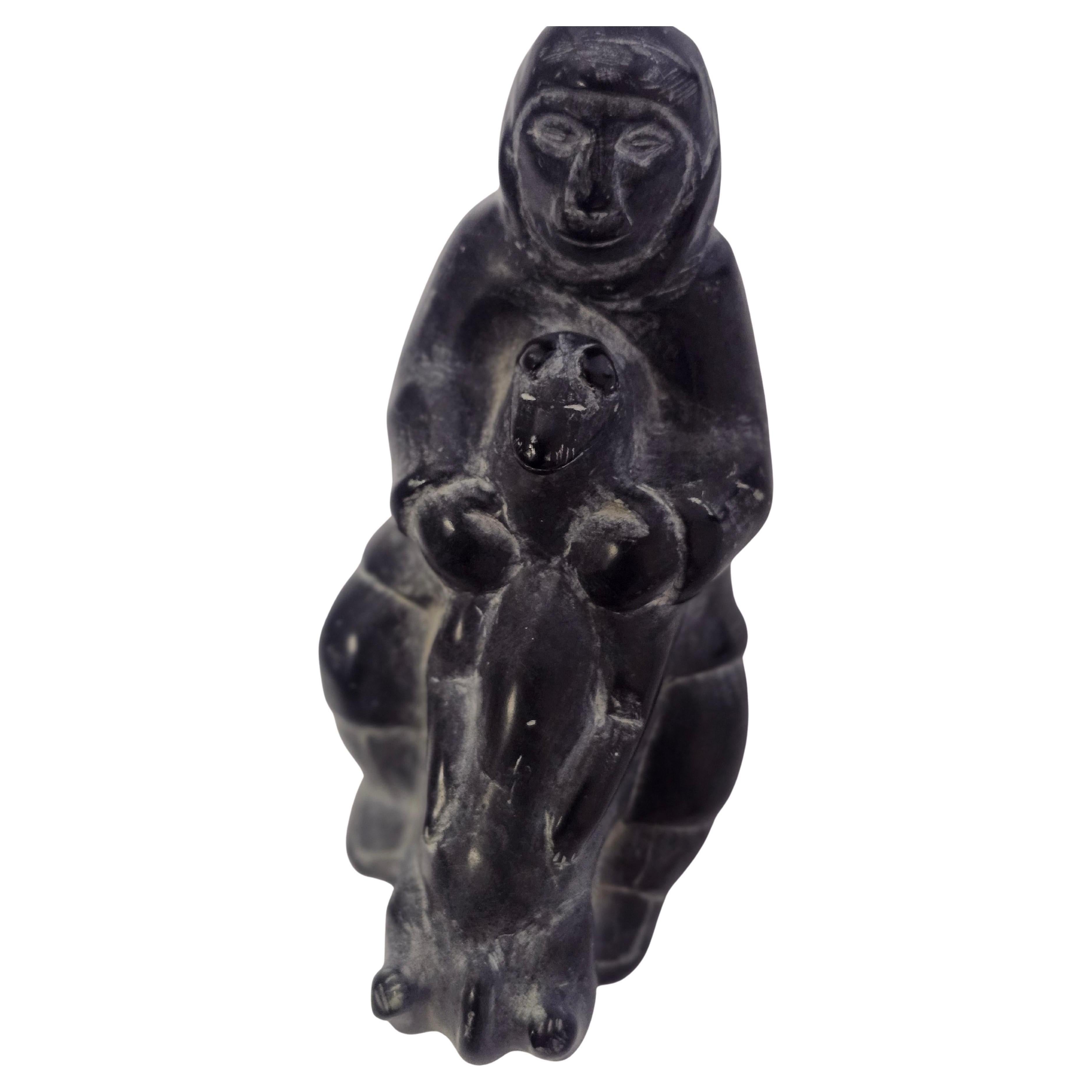 Beautiful craftsmanship hand carved Soapstone figure of a Man with a Bear.
Detailed and signed on the underside.
Eitger from Alaska or Canada. In excellent vintage condition with minimal wear from age and use.
Please see all pics and video as that