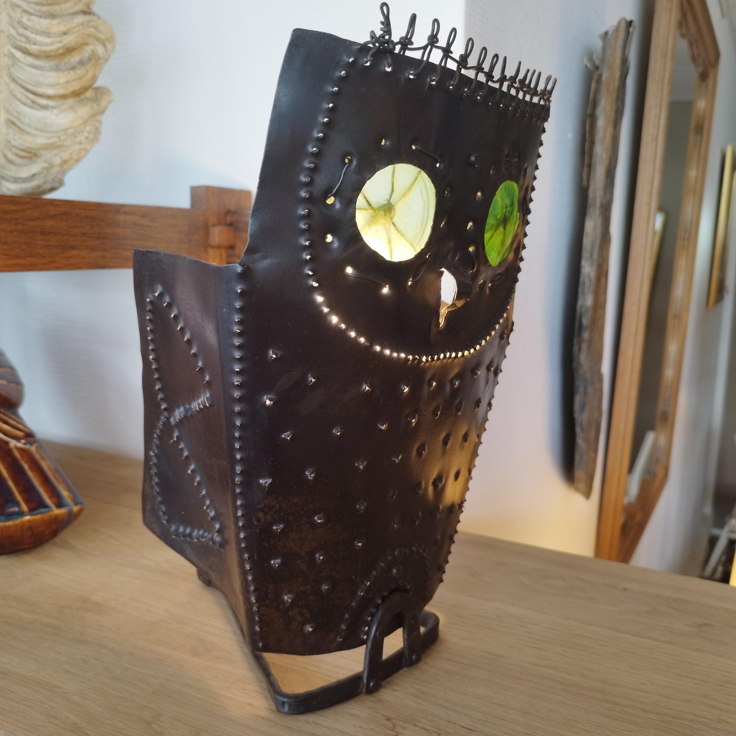 Folk Art metal and glass lamp representing an owl. The eyes are made of bottle bottoms. The wiring has been redone, and it has a baionnette socket.