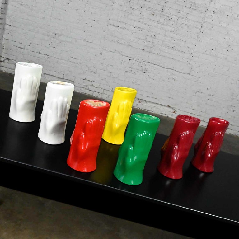 Gorgeous Folk Art style multi-color molded plastic or acrylic hand vases a set of 7. Beautiful condition, keeping in mind that these are vintage and not new so will have signs of use and wear. One of the maroon vases is partially filled. These are