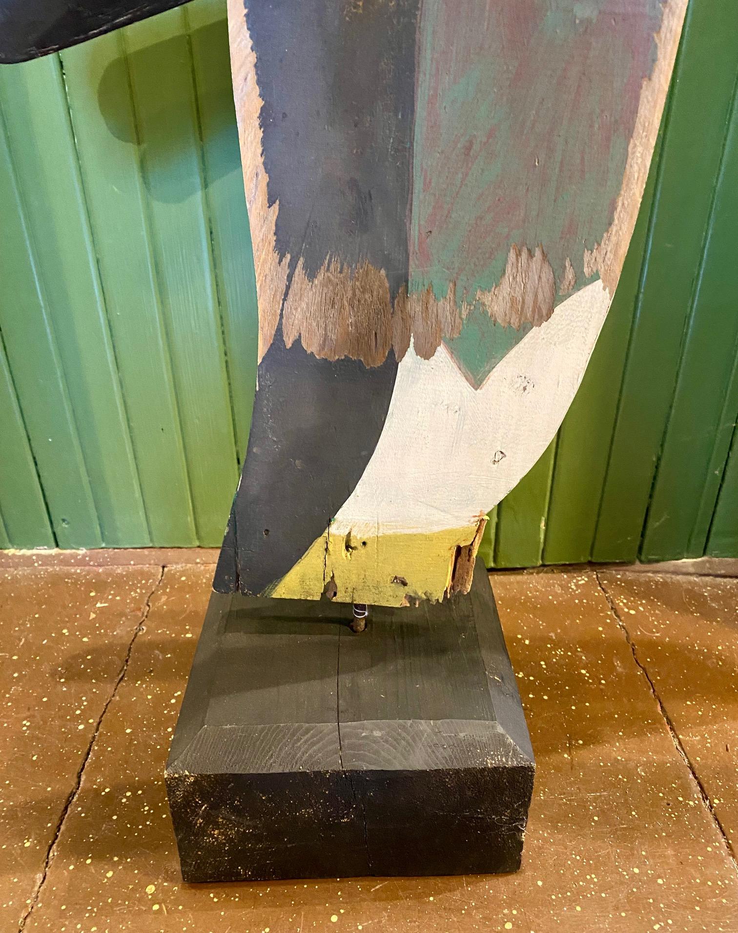 Early Vintage Penguin Whirligig from Plymouth, Massachusetts, circa 1930s - 1940s, a hand cut and painted wooden flat silhouette of a large penguin in worn original paint. The paddles are original as well, and made of un-vulcanized rubber. A unique