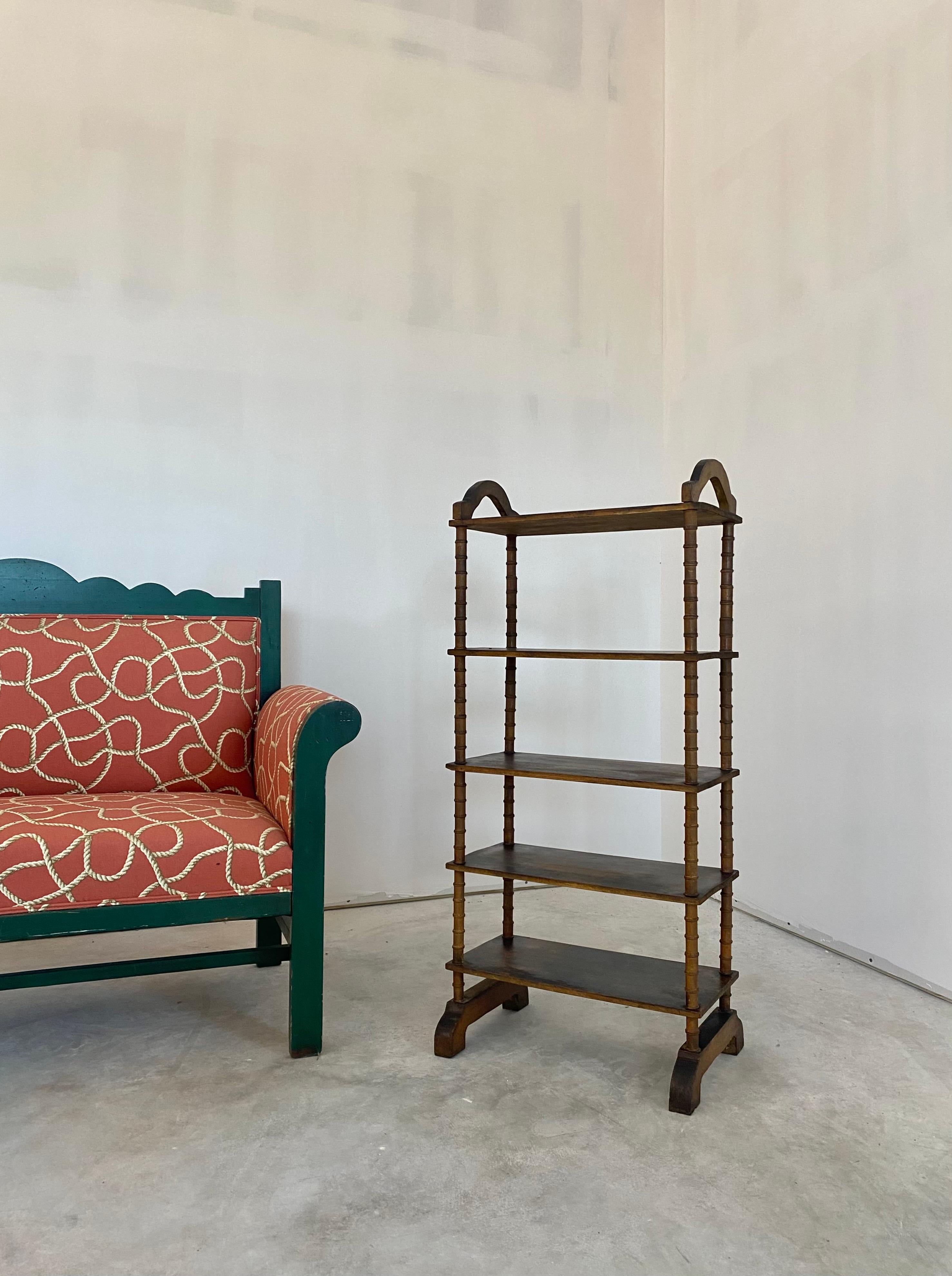 A Primitive Folk Art Spool Shelf. Fantastic patina and surface throughout. A very collectible rustic piece that immediately adds character and charm. This would be perfect for short stacks of books or the display of smaller items. It would show off