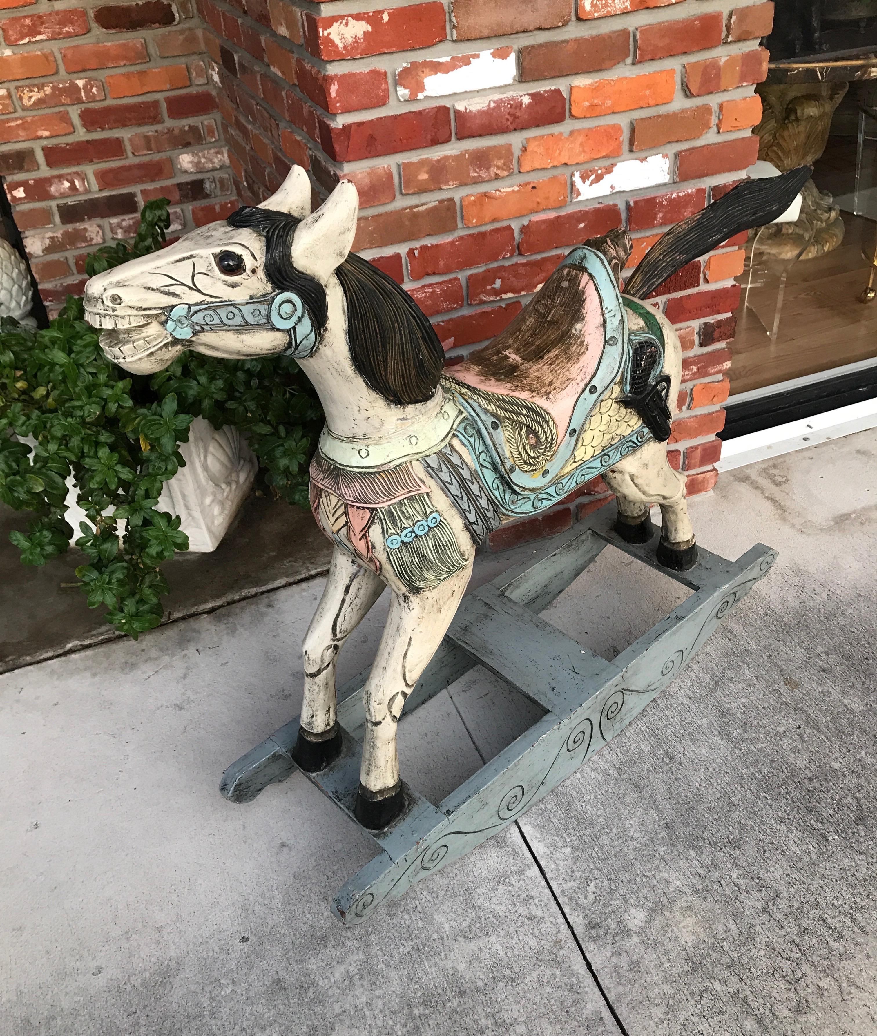 Hand carved and painted Folk Art rocking horse. Wonderful attention to detail.